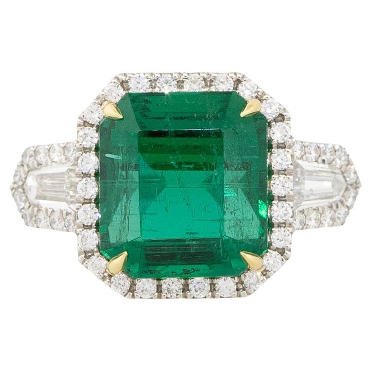 6.26 Carat Emerald and Diamond Halo Ring Platinum and 18 Karat In Stock For Sale