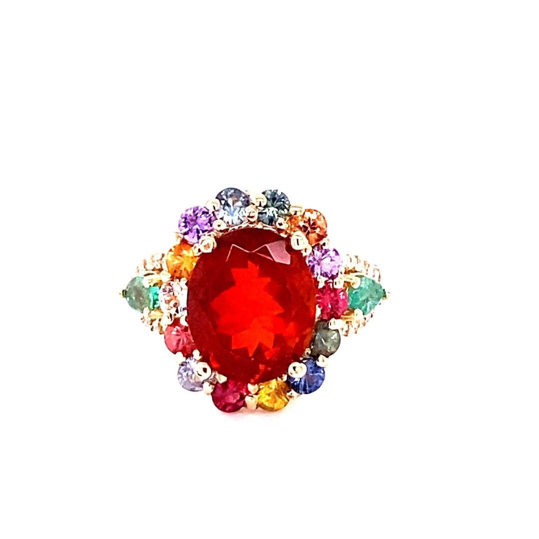 6.26 Carat Natural Fire Opal Sapphire Diamond Yellow Gold Cocktail Ring

This ring has a beautiful 3.73 Carat Oval Cut Fire Opal as its center stone and is elegantly surrounded by 20 Multi-Colored Sapphires that weigh 2.06 Carats and 26 Round Cut