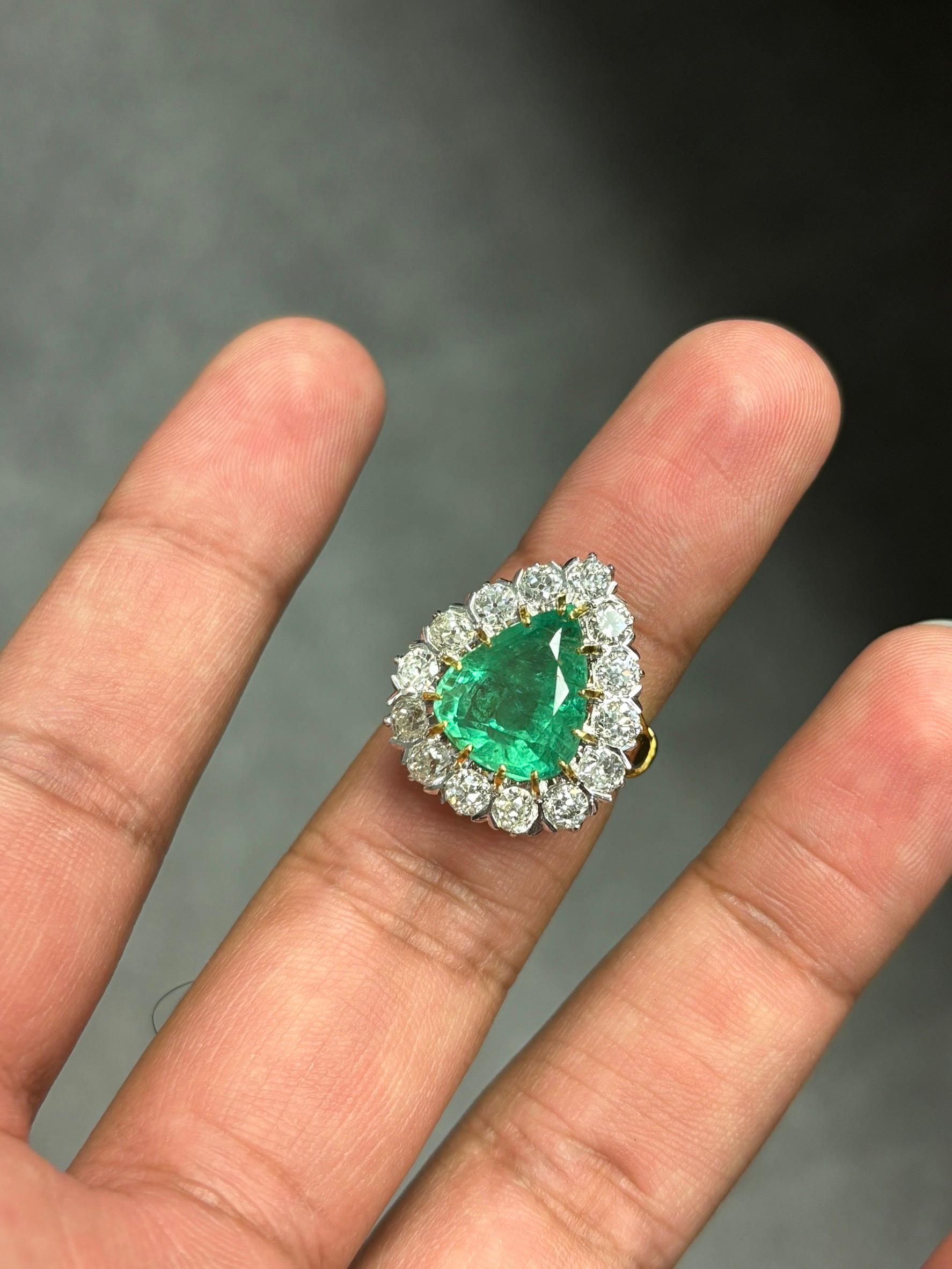 Showcasing a super sensational and an astonishing piece of jewelry, meticulously handcrafted to enchant all connoisseurs of art deco-inspired designs!

This remarkable ring showcases an awe-inspiring 6.27 Carat Emerald as its centerpiece, radiating
