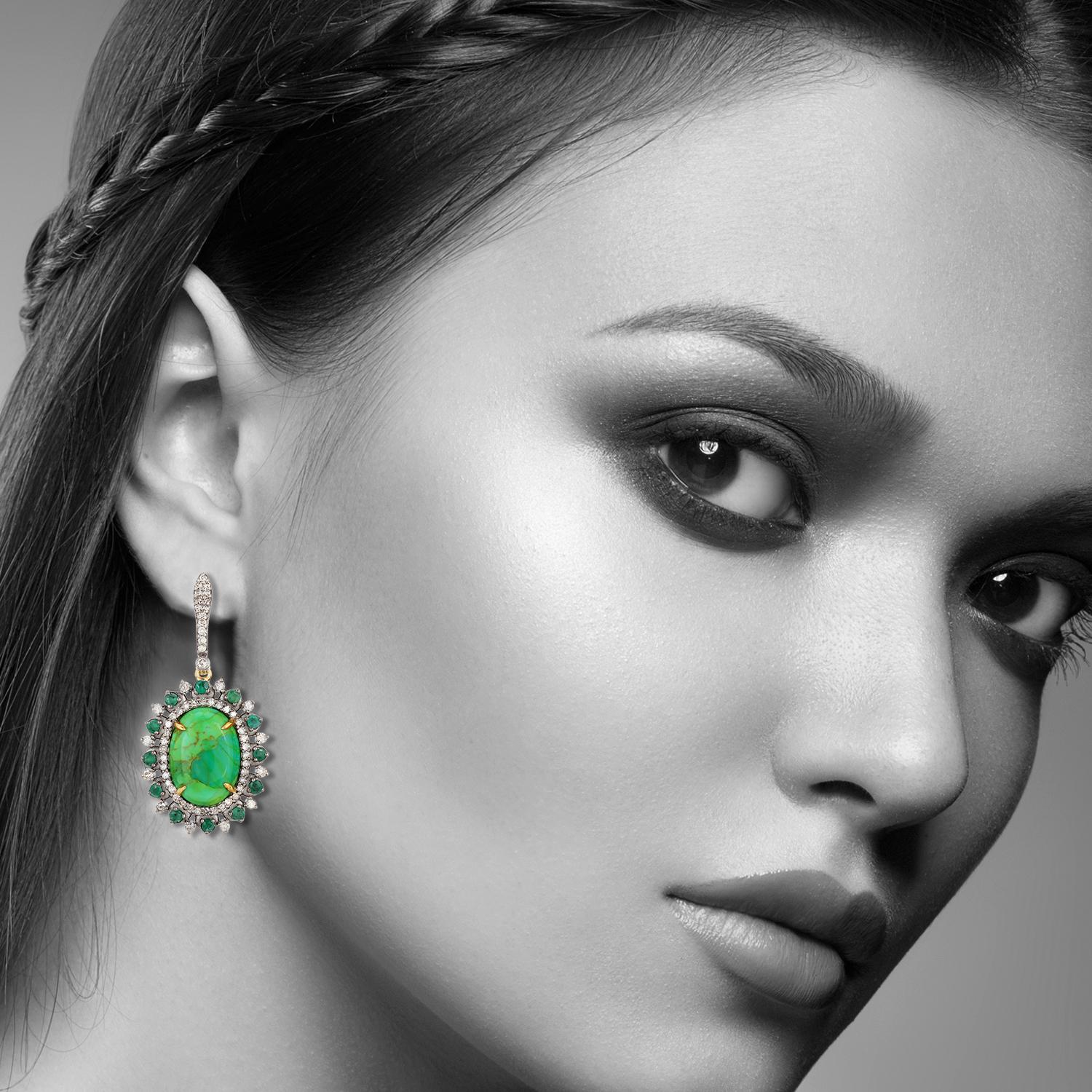 These beautiful earrings are meticulously crafted in 18-karat gold and sterling silver.
It is set in 6.27 carats turquoise, .74 carats emerald and .86 carats of diamonds. 

FOLLOW  MEGHNA JEWELS storefront to view the latest collection & exclusive