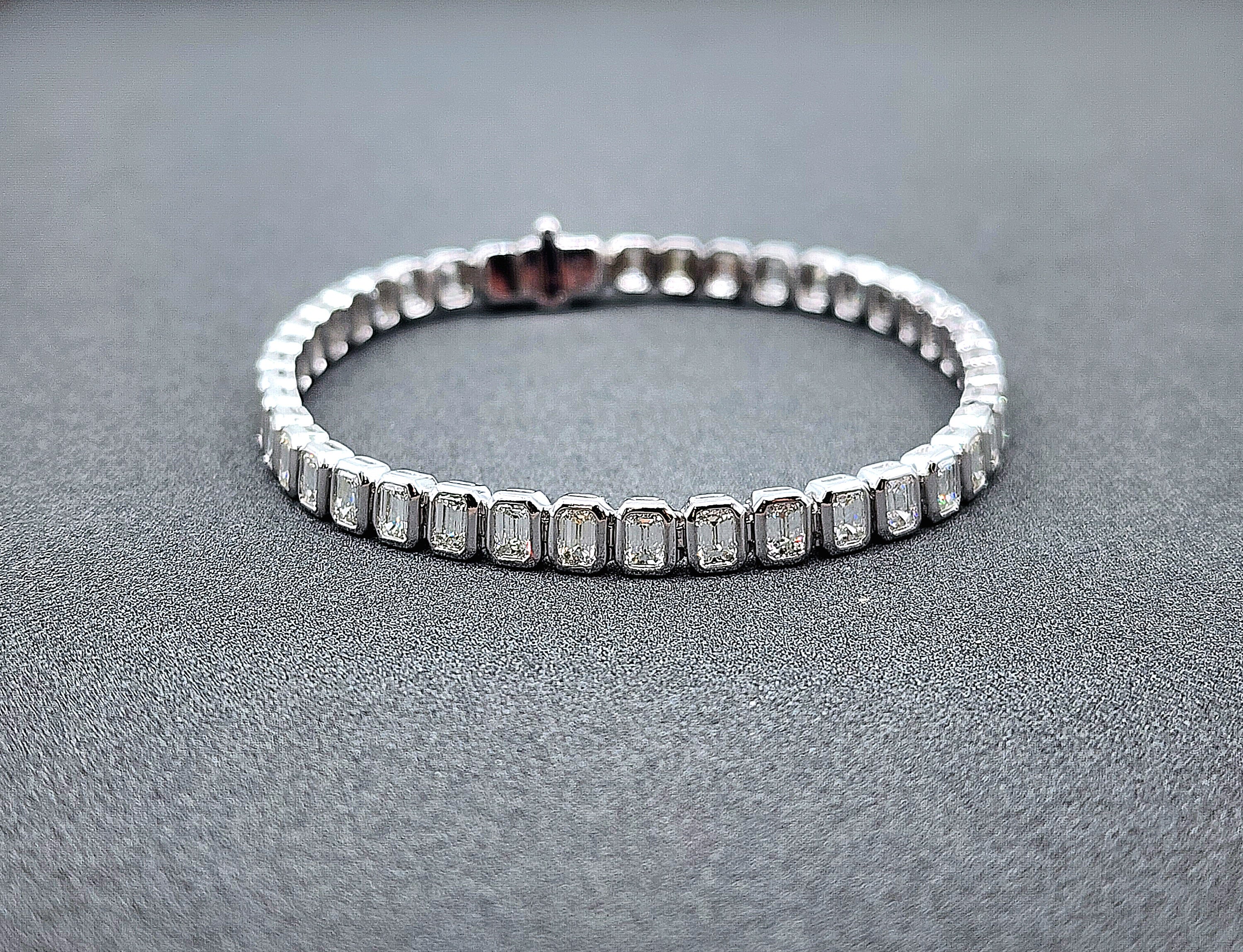 This beautiful modern tennis bracelet showcases 6.27 carats of emerald-cut diamonds. The diamonds are white, with a clarity of VS1/VS2 and a color grade of F/G. Crafted in platinum, this piece is a refined addition to any collection. Made in the