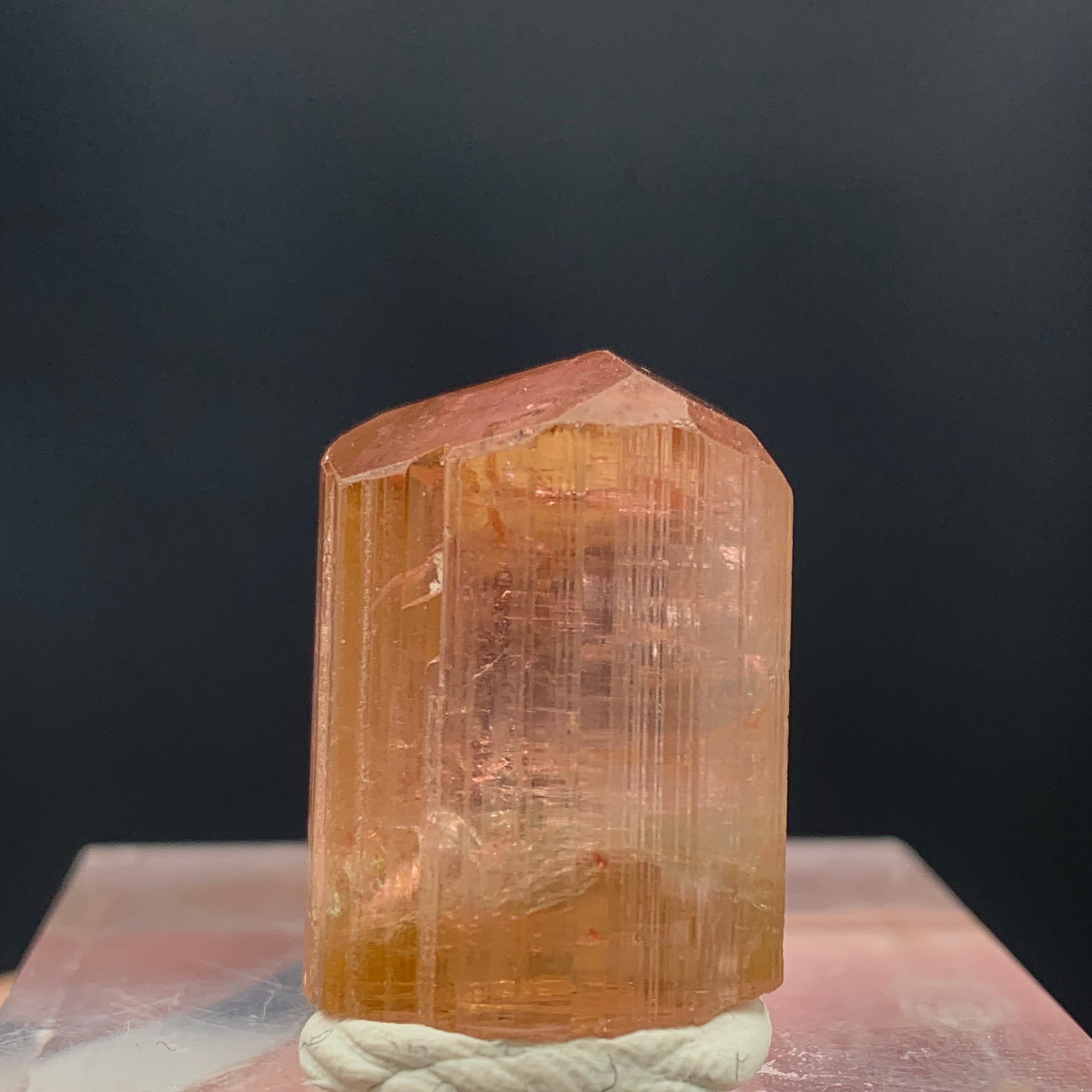 Lovely Peach Color Tourmaline Crystal From Paprook, Afghanistan
WEIGHT: 62.70 Carat
DIMENSIONS:2.3 x 1.7 x 1.5 Cm
ORIGIN: Afghanistan
COLOR: Peach 
TREATMENT: None

Tourmaline is an extremely popular gemstone; the name Tourmaline is derived