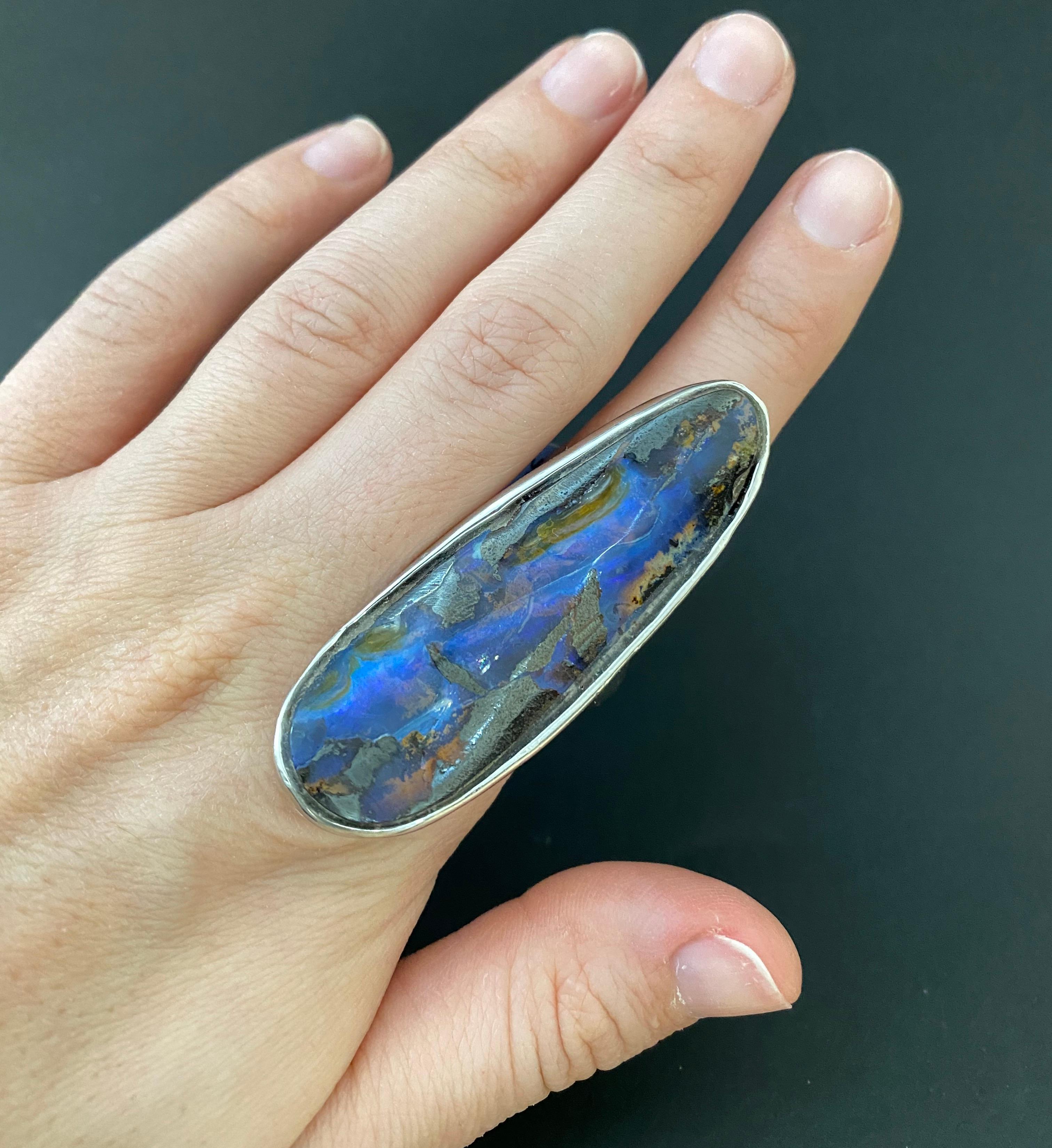 Material: Silver
Gemstone: 1 Opal at 62.77 Carats.
Ring Size: 6.5 Alberto offers complimentary sizing on all rings.
This piece measures approximately 55 x 22 millimeters.
Fine one-of-a-kind craftsmanship meets incredible quality in this breathtaking