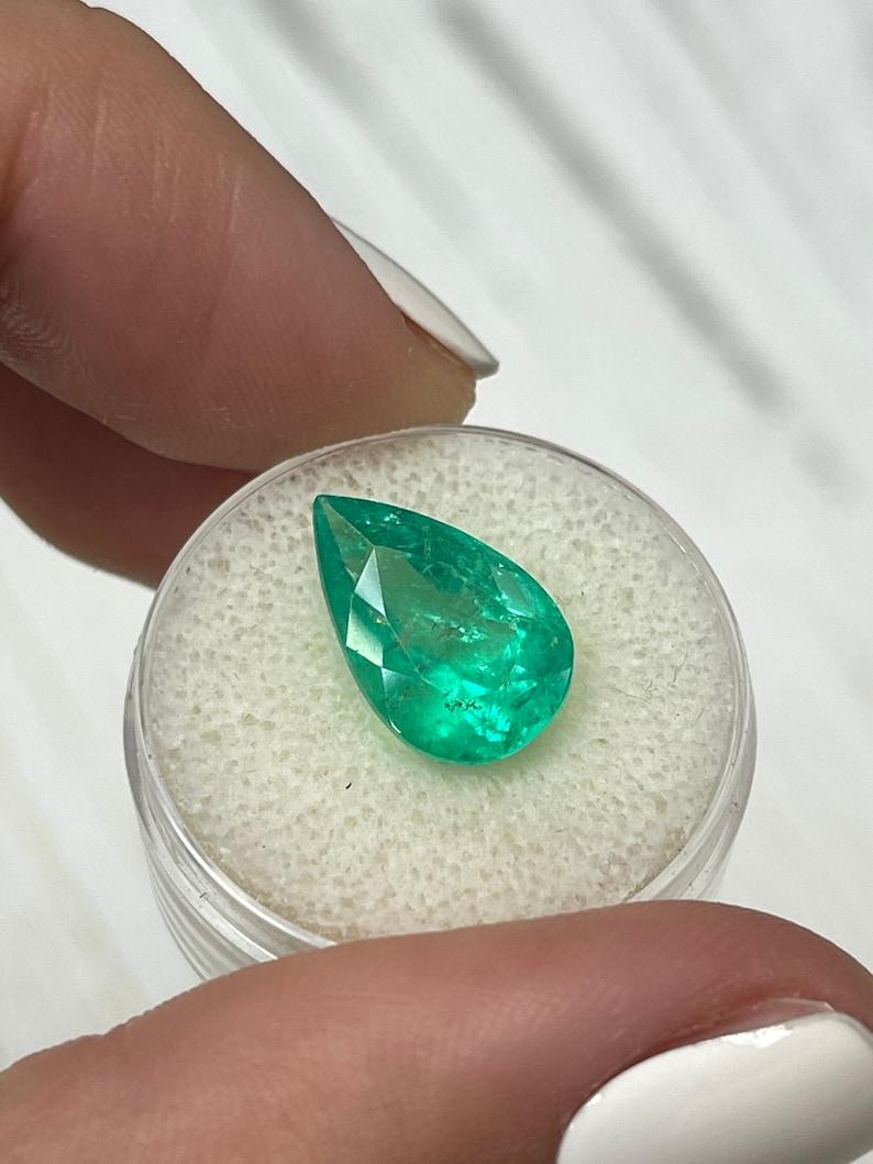 Women's 6.28 Carat Yellowish Muzo Green Colombian Emerald - Pear-Cut May Birthstone For Sale