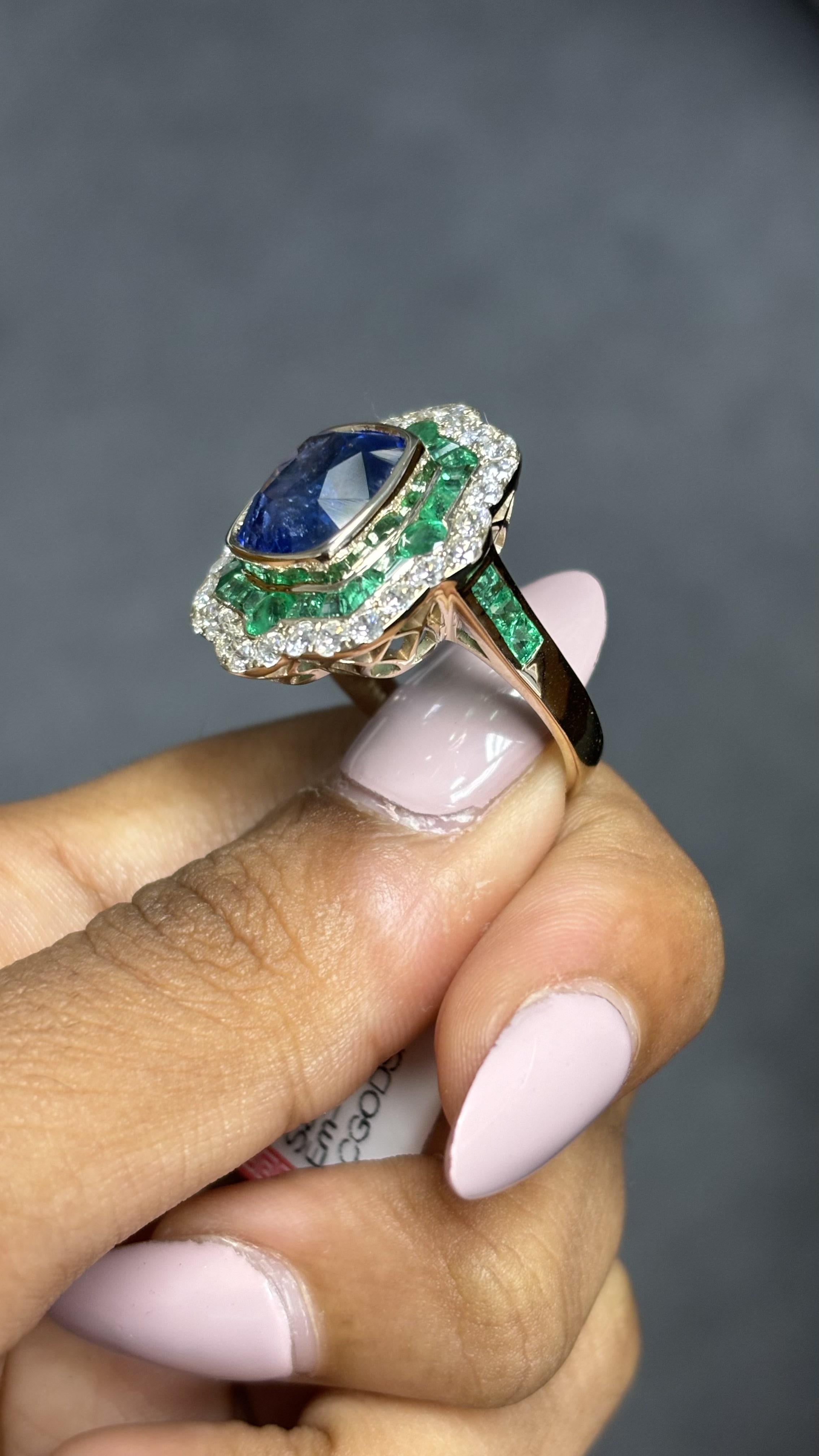 6.28ct Cornflower Blue Sapphire, 1.60ct Emerald, 1.02ct Diamond 18K Gold Ring 9