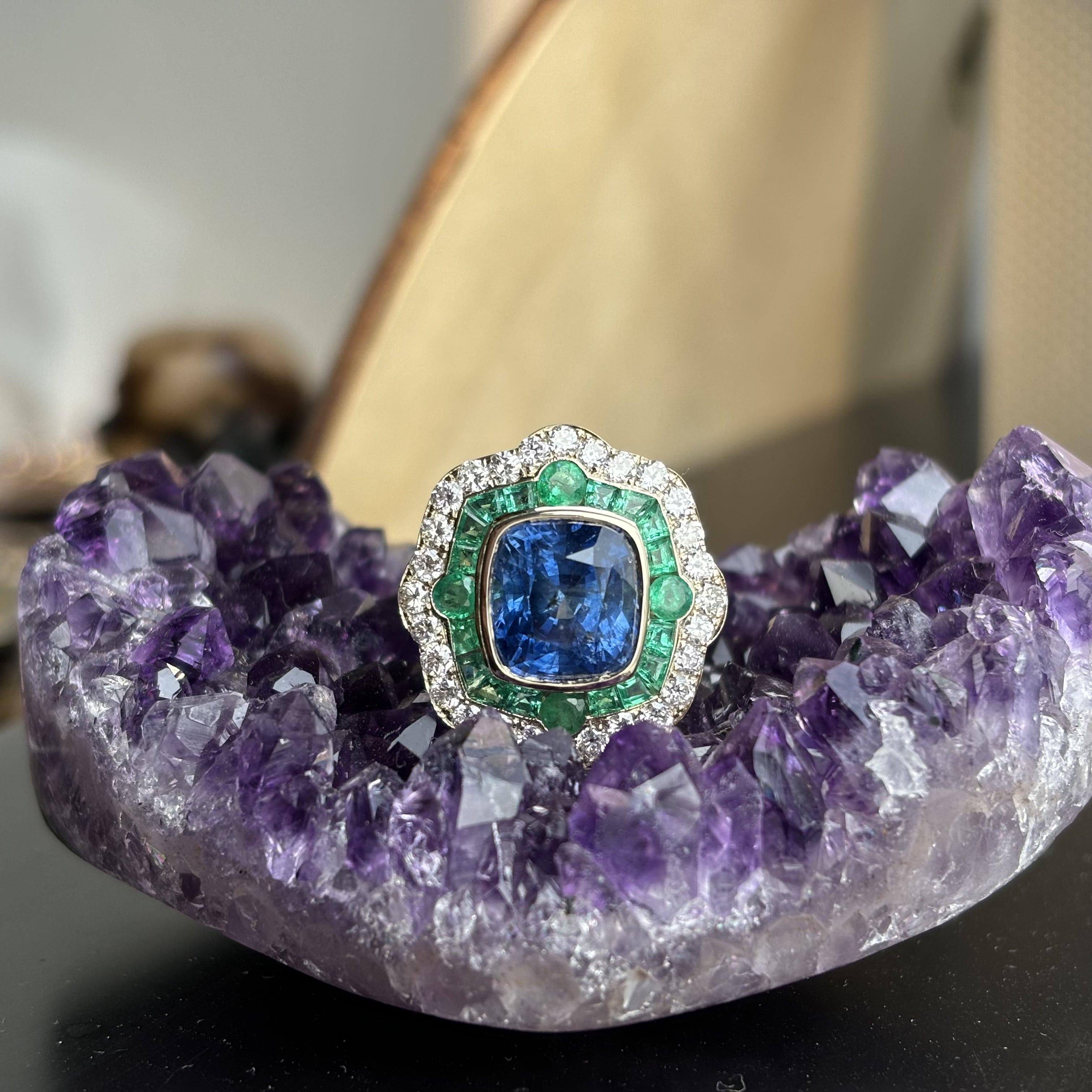 Cushion Cut 6.28ct Cornflower Blue Sapphire, 1.60ct Emerald, 1.02ct Diamond 18K Gold Ring