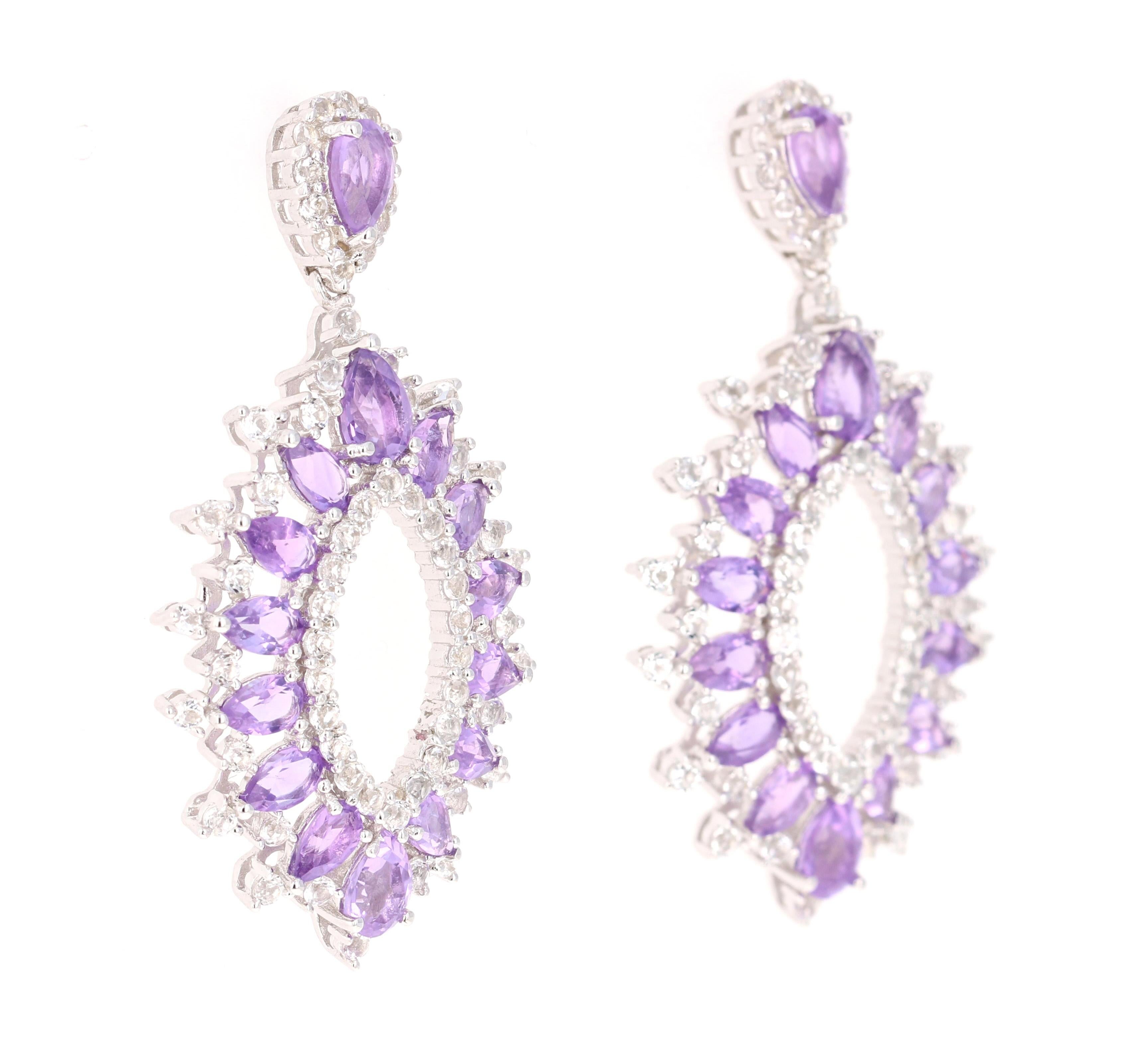 Stunning Chandelier Dangle Earrings 

These earrings have 6.29 Carats of Amethyst and White Topaz.

They are beautifully curated in 925 Silver weighing approximately 11.5 grams 

They are 1.75 inches long. 
