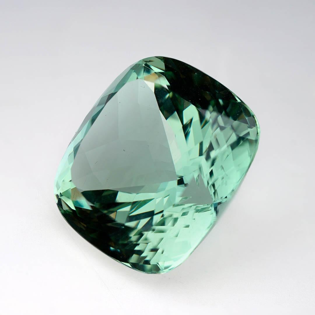 This impressive 62.9 carat natural Fluorite gemstone is a museum-caliber specimen showcasing the stunning luminosity for which Fluorite is prized. With remarkable clarity and a sparkling green hue, this large Fluorite is expertly faceted to