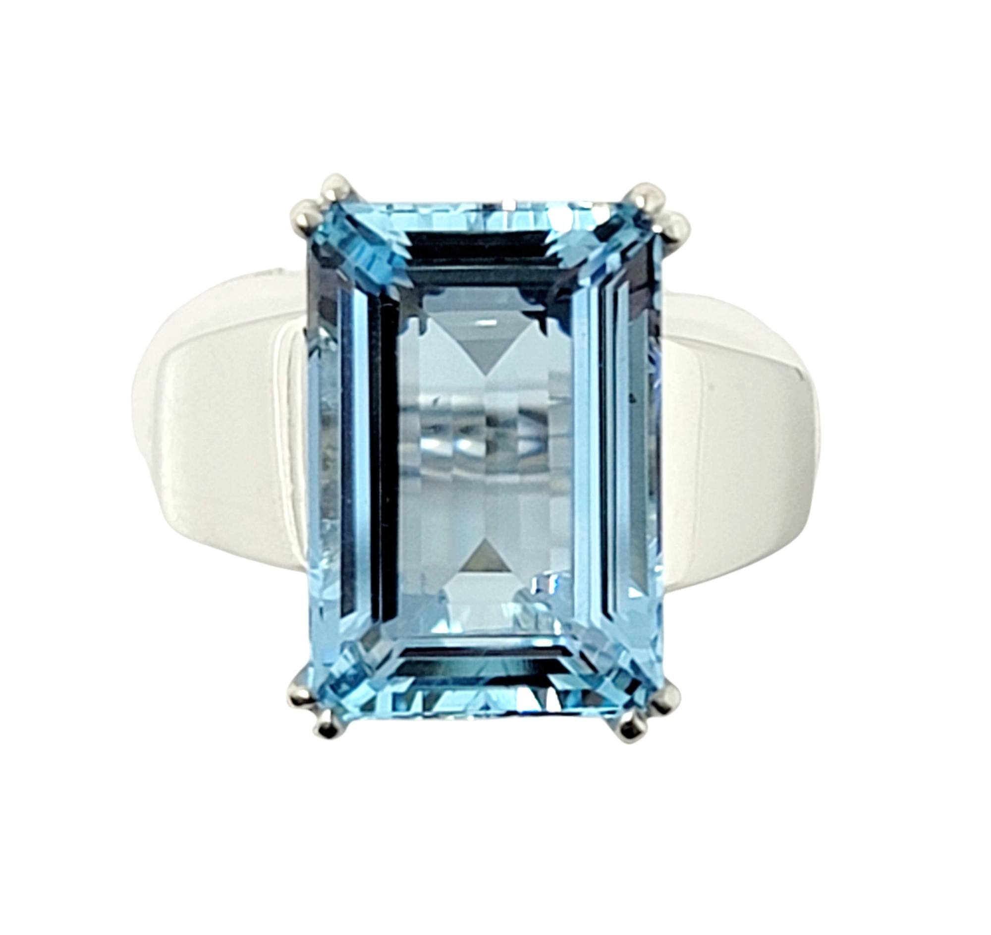 Ring size: 5.5

Breathtaking aquamarine cocktail ring. This eye-catching piece makes a bold statement with both its impressive size and exquisite color. The incredible 6.29 carat emerald cut aquamarine stone is prong set in 18 karat white gold and