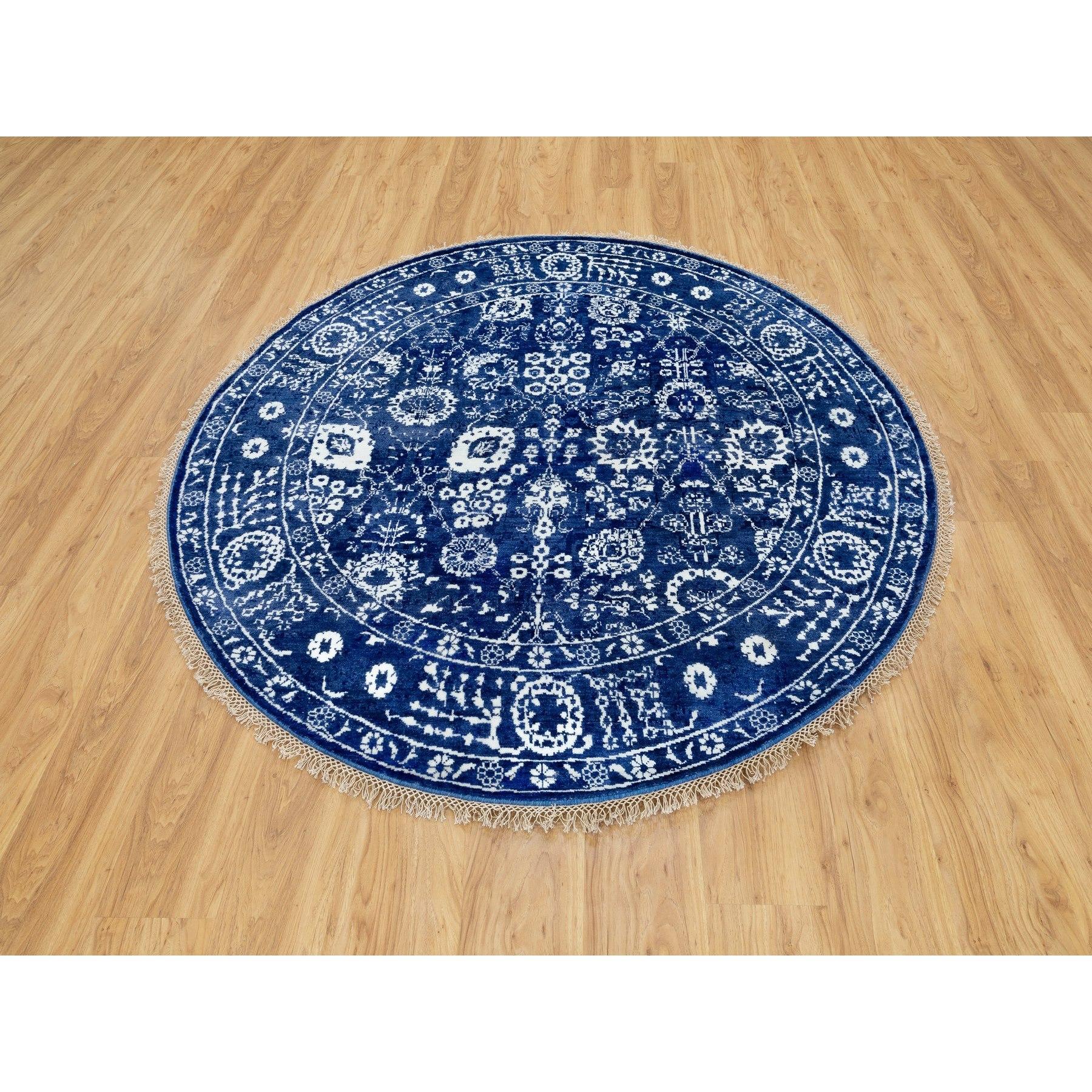 This is a truly genuine one-of-a-kind Blue Tone On Tone Tabriz Wool and Silk Round Hand Knotted Oriental Rug. It has been woven for months and months in the centuries-old Persian weaving craftsmanship techniques by expert artisans.
Primary