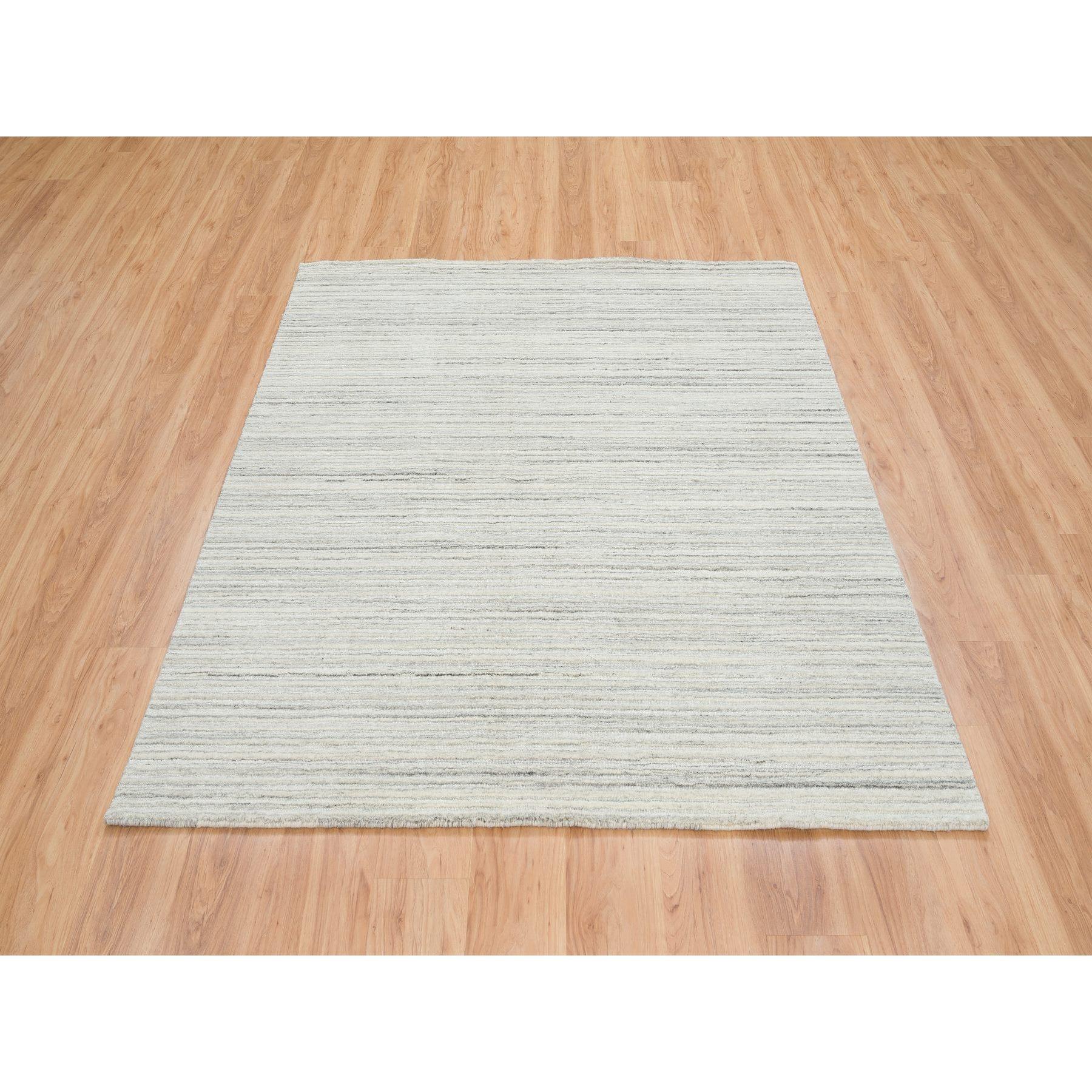 This is a truly genuine one-of-a-kind Ivory and Cream, Undyed Natural Wool Modern Design, Thick and Plush Plain Hand Loomed, Square Oriental Rug. It has been Loomed for months and months in the centuries-old weaving craftsmanship techniques by