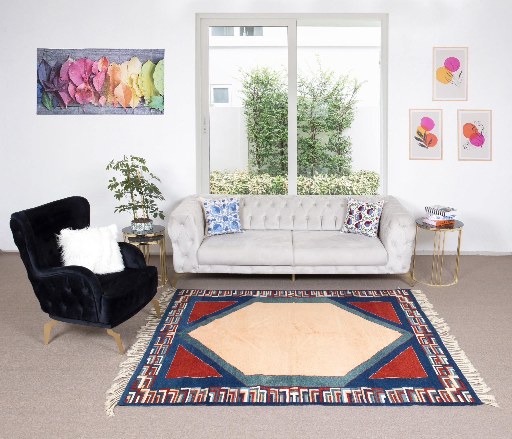 A hand-knotted contemporary Turkish rug featuring a geometric design. 

This colorful modern rug has even medium wool pile on wool foundation.
 It is made of premium hand-spun sheep and natural dyes, ie. plant based non chemical dyes making it