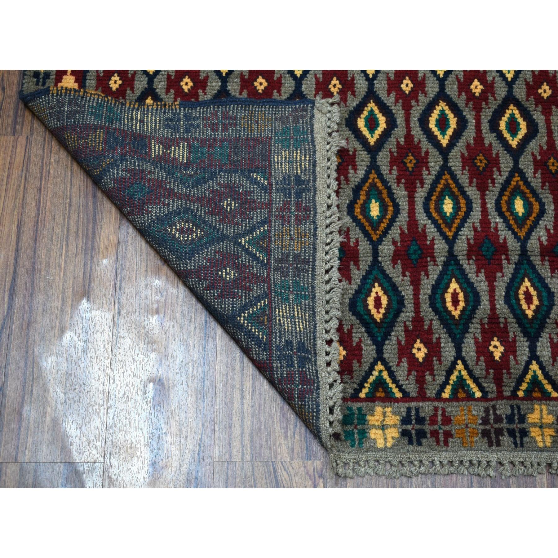 This is a truly genuine one-of-a-kind Gray Tribal Design Colorful Afghan Baluch Hand Knotted Pure Wool Oriental Rug. It has been woven for months and months in the centuries-old Persian weaving craftsmanship techniques by expert artisans.
Primary