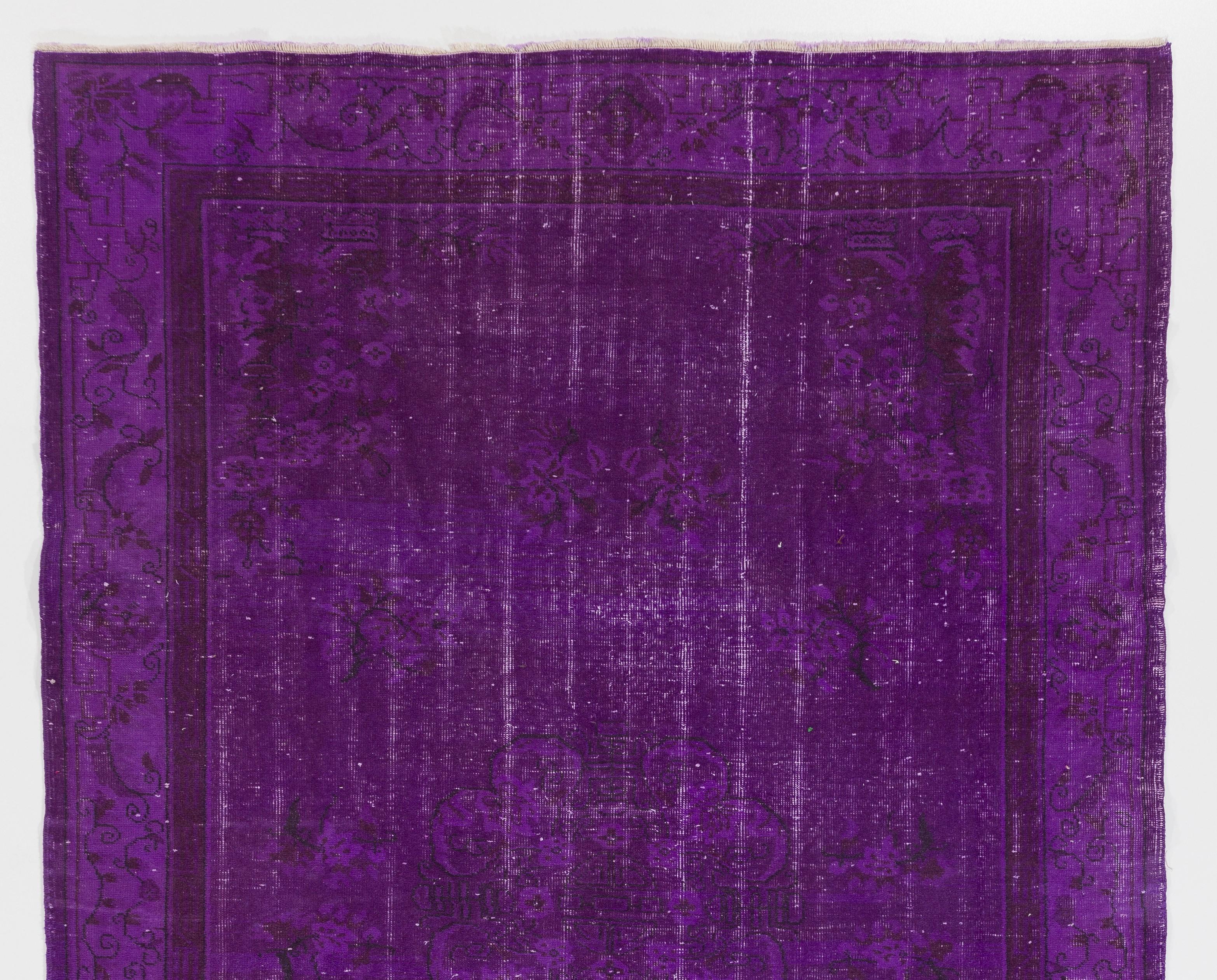 A vintage Turkish area rug re-dyed in purple color for contemporary interiors.
Finely hand knotted, low wool pile on cotton foundation. Professionally washed.
Sturdy and can be used on a high traffic area, suitable for both residential and