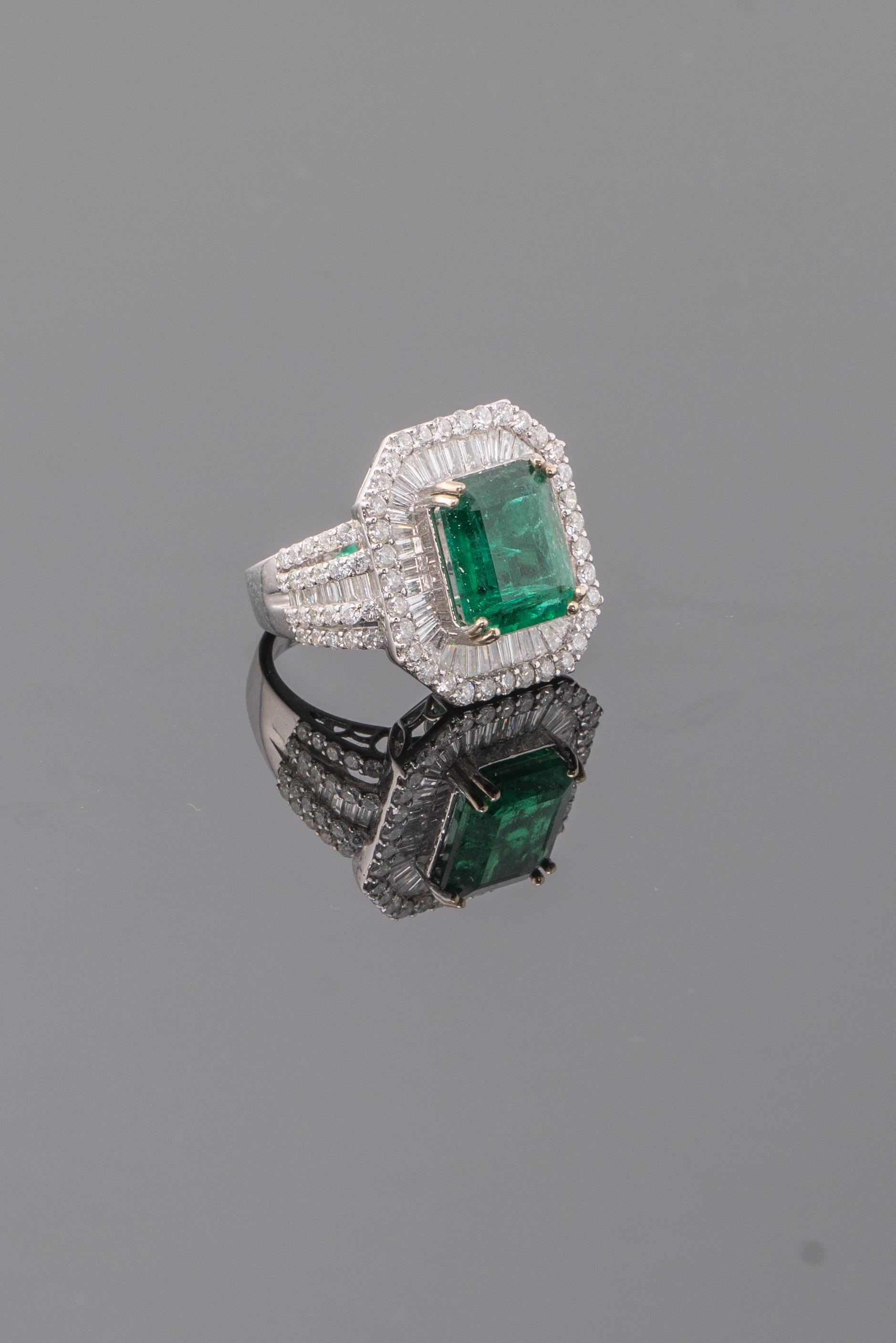 A beautiful 6.30 carat Emerald cocktail engagement ring, with high quality diamonds surrounding it - the Emerald has great luster and an ideal vivid green color. It is a perfect ring if you want to make a statement!
Currently sized at US 7, can
