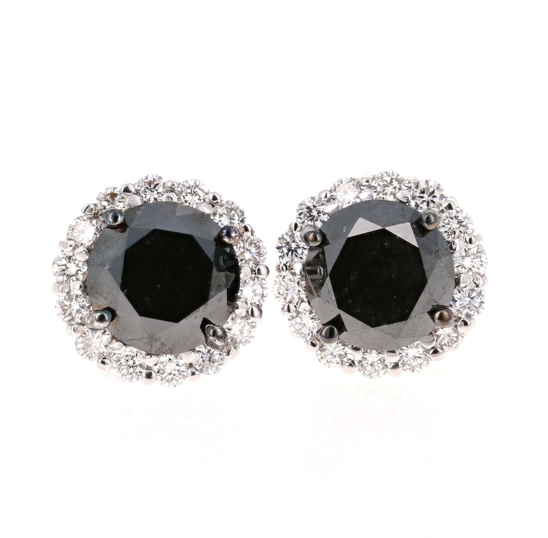 Beautiful 6.30 Carat Black Diamond and White Diamond Stud Earrings in 14K White Gold.  

These earrings have 2 Black Round Cut Diamonds that weigh 5.49 Carats and 28 Round Cut Diamonds that weigh 0.81 Carats. The White Diamonds have a clarity and