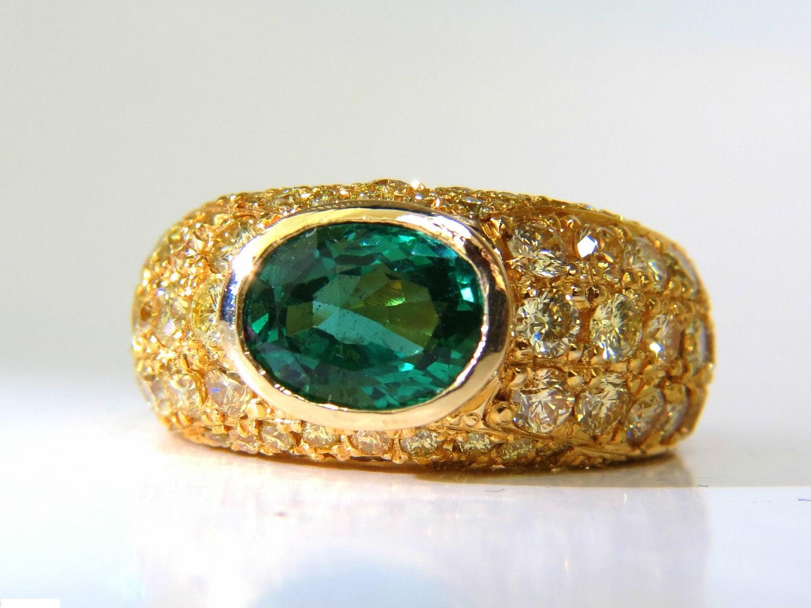 1.80 Natural Emerald

Clear A+ clarity & Vivid green

Full Oval cut, Flush set



4.50ct. Natural Fancy yellow diamonds

Microset french pave by hand!

Vs-1 Vs-2 clarity



14kt. yellow gold

ring is:

10.14 mm thick

Depth:

7.50mm



6.5
