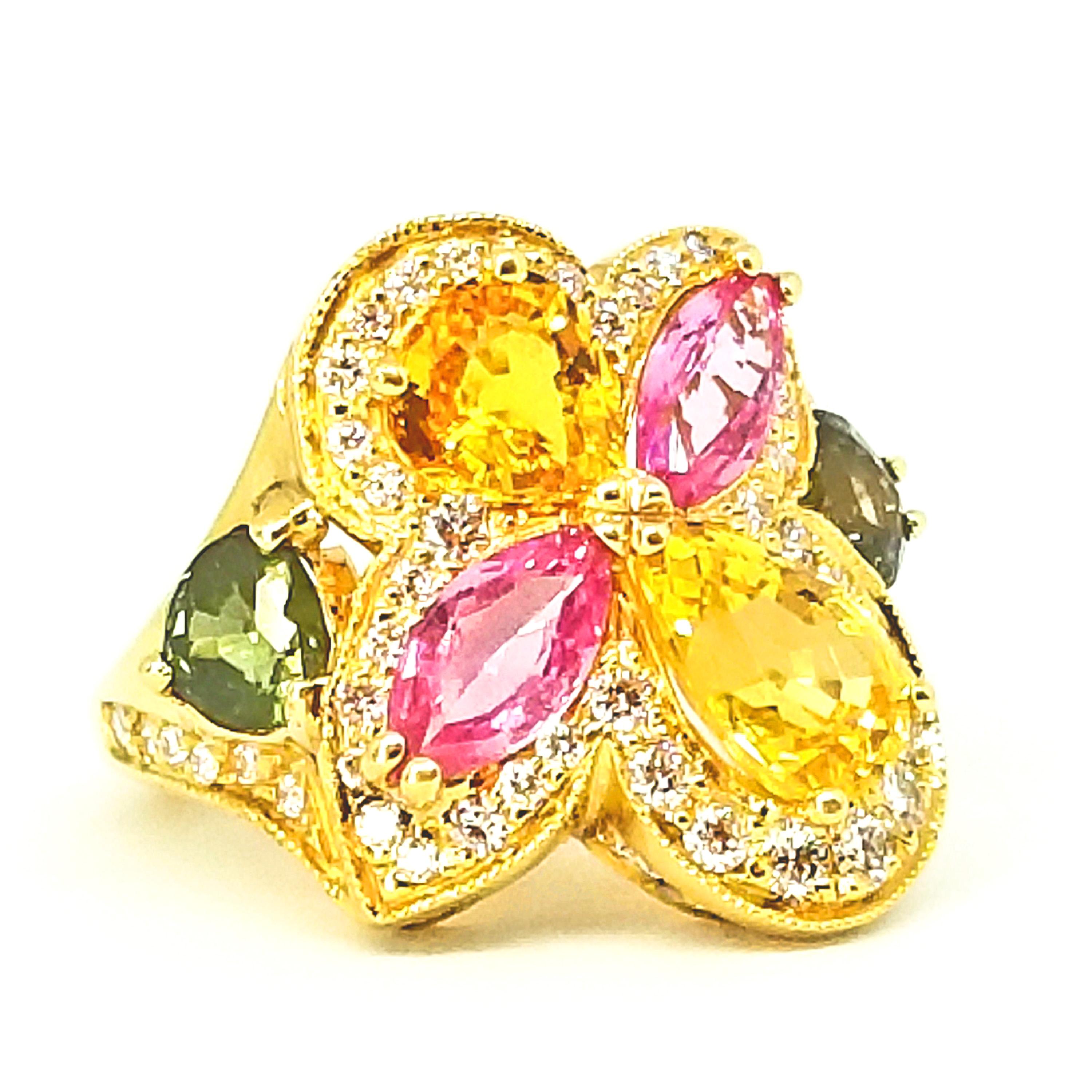 One of a Kind Cocktail Right Hand Ring is set with 6.30 carats total weight of multiple Color and Cut Sapphires. Set in a Floral Cluster are two Golden Yellow Sapphire Pear Shapes, two Bubble Gum Pink Marquis Sapphires and two Deep Green Heart Shape