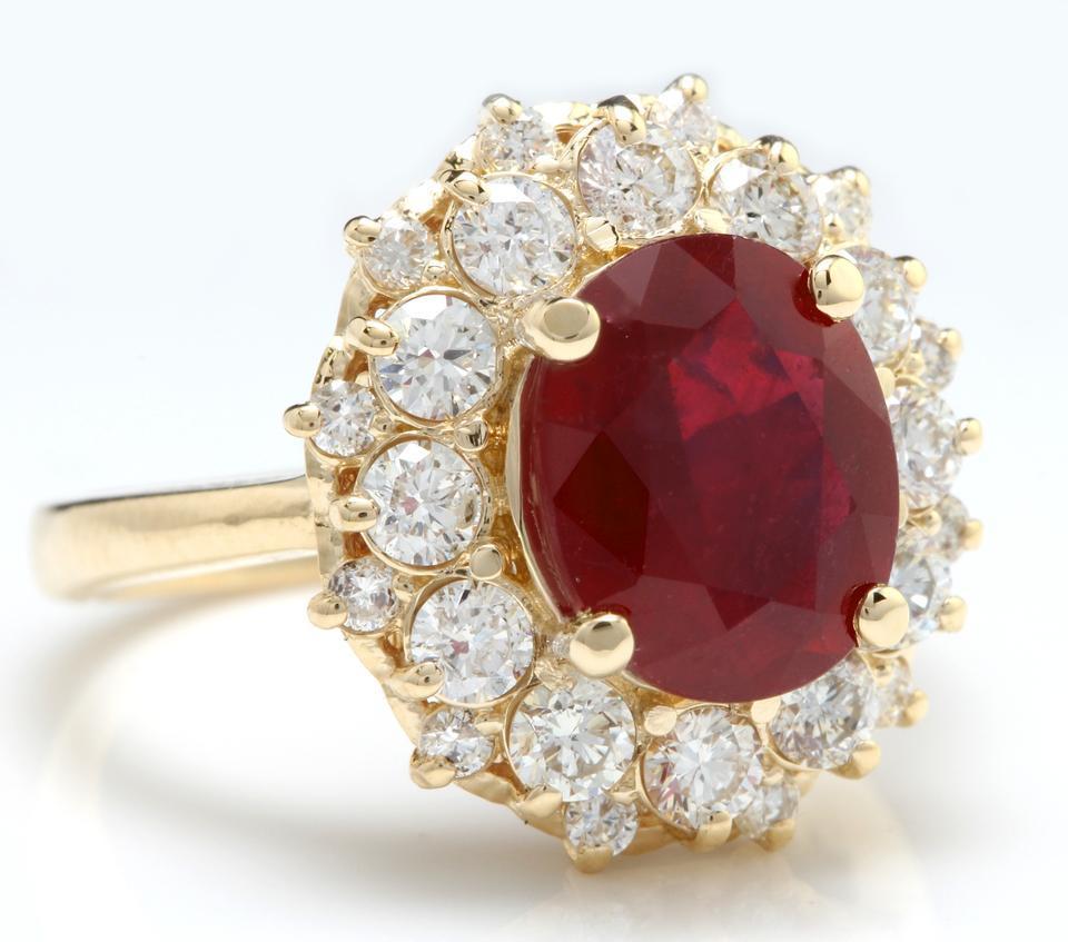 6.bague en or jaune 14 carats, impressionnant rubis rouge et diamant 30 carats

Le poids total du rubis rouge est de : 5.00 Carats (Traités : Remplissage de verre de plomb)

Mesures du rubis : 10.11 x 8.06mm

Diamants ronds naturels Poids : 1.30