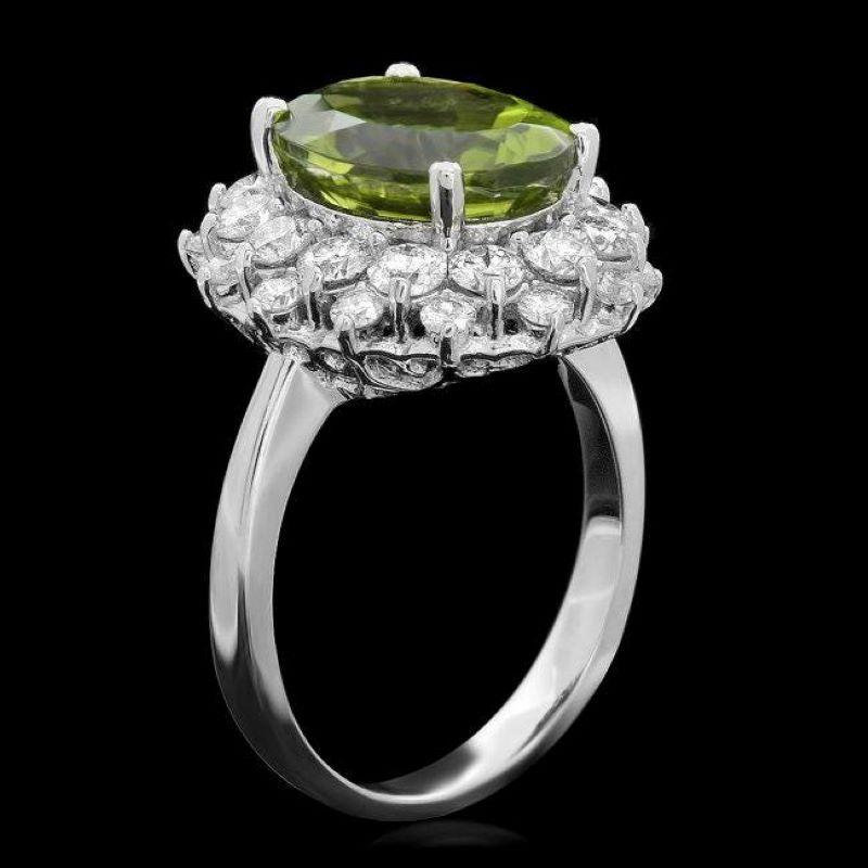 6.30 Carats Natural Very Nice Looking Peridot and Diamond 14K Solid White Gold Ring

Total Natural Oval Cut Peridot Weight is: Approx. 4.80 Carats 

Peridot Measures: Approx. 10 x 12mm

Natural Round Diamonds Weight: Approx. 1.50 Carats (color G-H /