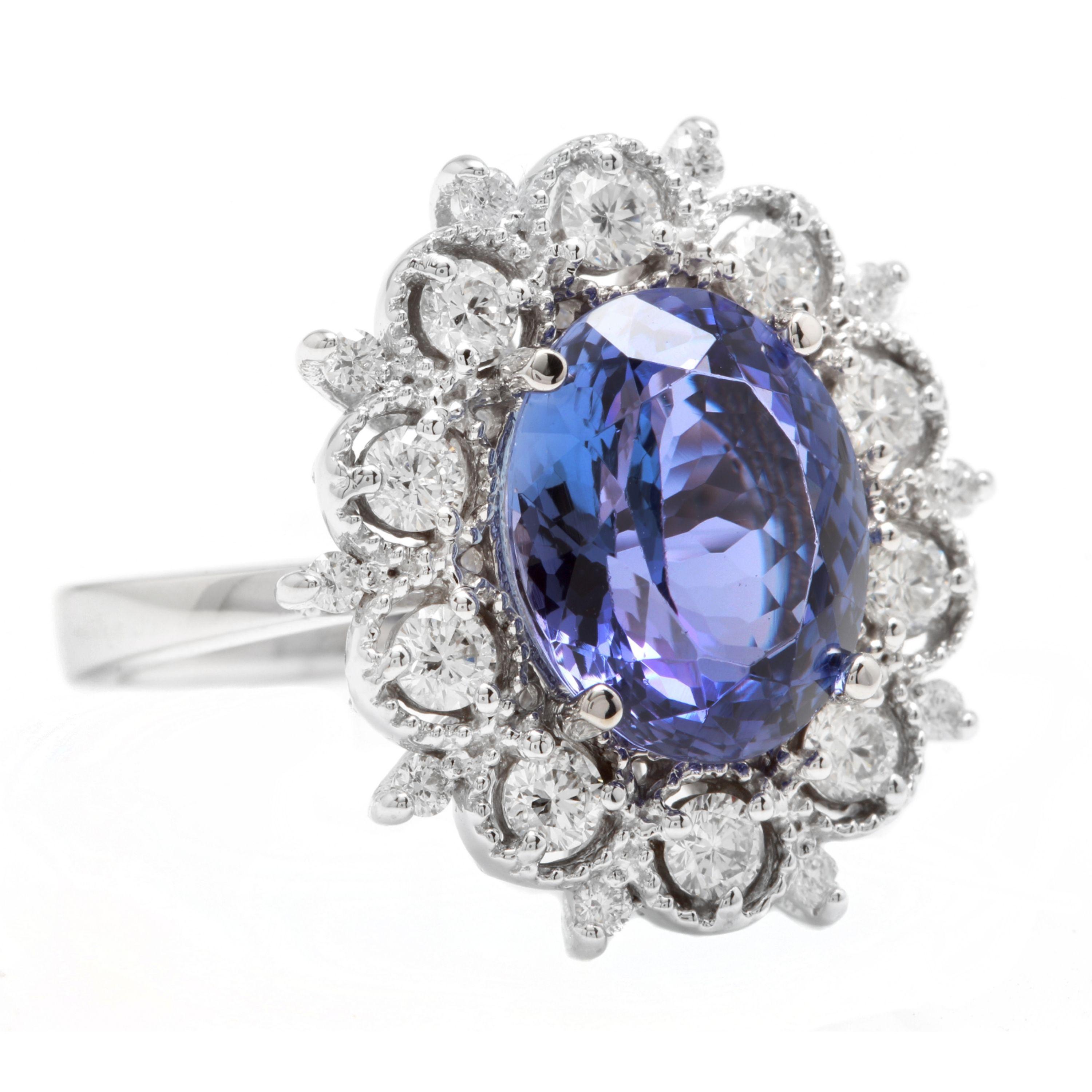 6.30 Carats Natural Very Nice Looking Tanzanite and Diamond 14K Solid White Gold Ring

Total Natural Oval Cut Tanzanite Weight is: Approx. 5.30 Carats

Tanzanite Measures: 12.00 x 10.00

Natural Round Diamonds Weight: Approx. 1.00 Carats (color G-H