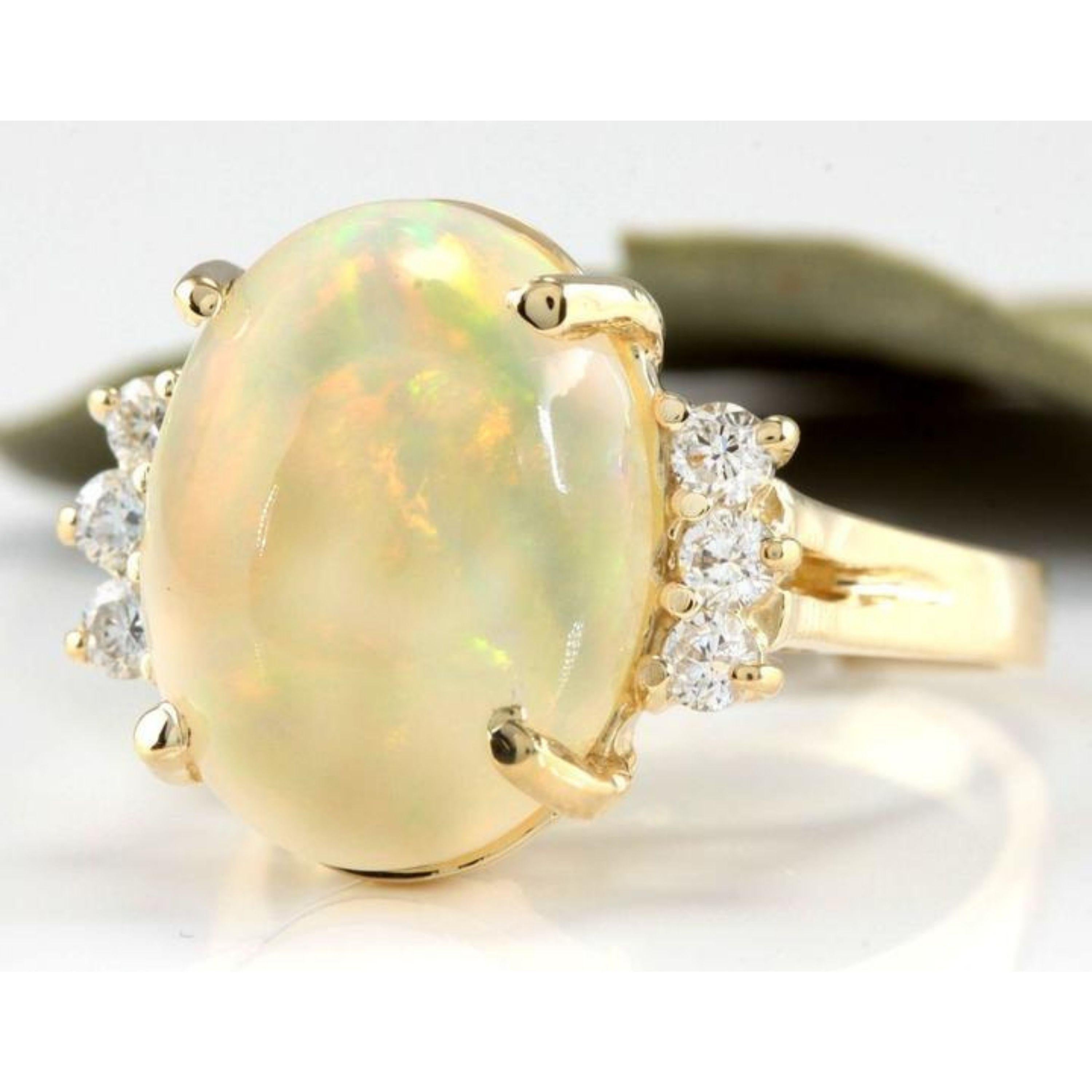 6.30 Carats Natural Impressive Ethiopian Opal and Diamond 14K Solid Yellow Gold Ring

Total Natural Opal Weight is: Approx. 6.00 Carats

Opal Measures: 14.50 x 11.40mm

Natural Round Diamonds Weight: Approx. 0.30 Carats (color G-H / Clarity