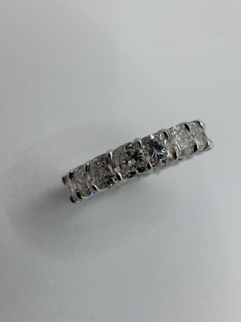This Beautiful Eternity Band is set with 18 perfectly matched Cushion Cut Diamonds, each weighing approximately 0.35ct for a total of 6.31 Carats. Each stone is of F-G color and VVS-VS clarity. Made in New York City using Platinum 950. Fits US Size