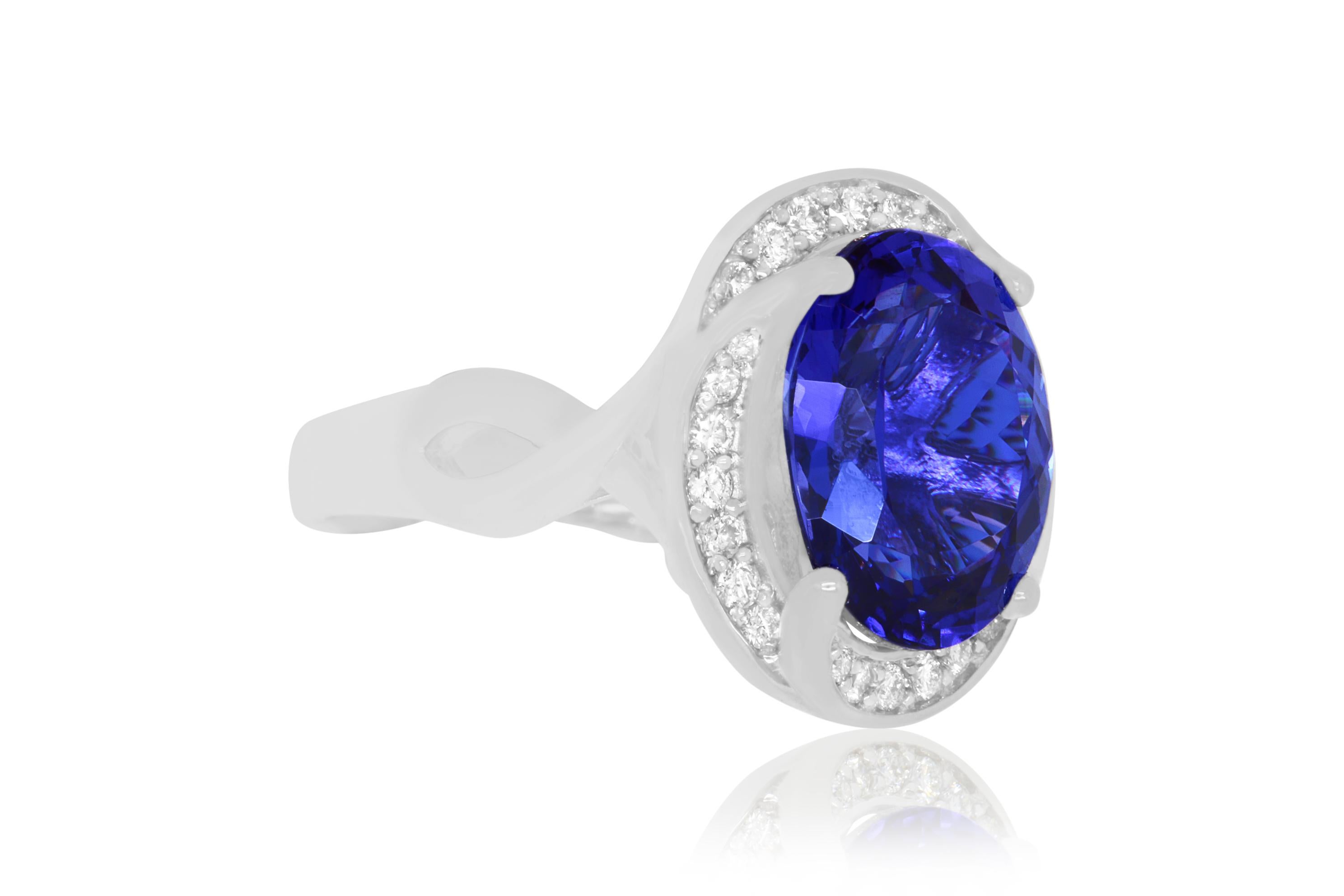 A stunning 6.31 Carat Oval Shaped Tanzanite is beautifuly set in a 14K white gold and surrounded by waves of dazzling round white diamonds totaling 0.31 Carats.

Material: 14k White Gold
Gemstones: 1 Oval Shaped Tanzanite at 6.31 Carats. - AAA