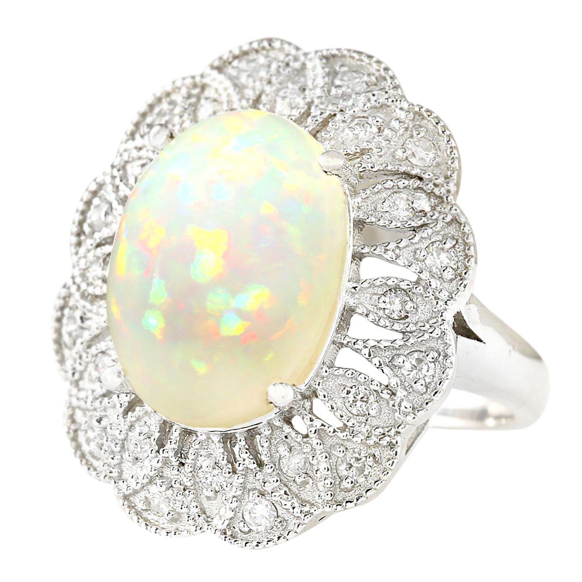 6.32 Carat Natural Opal 14 Karat White Gold Diamond Ring
Stamped: 14K White Gold
Total Ring Weight: 10.5 Grams
Total Natural Opal Weight is 5.82 Carat (Measures: 16.00x12.00 mm)
Color: Multicolor
Total Natural Diamond Weight is 0.50 Carat
Color:
