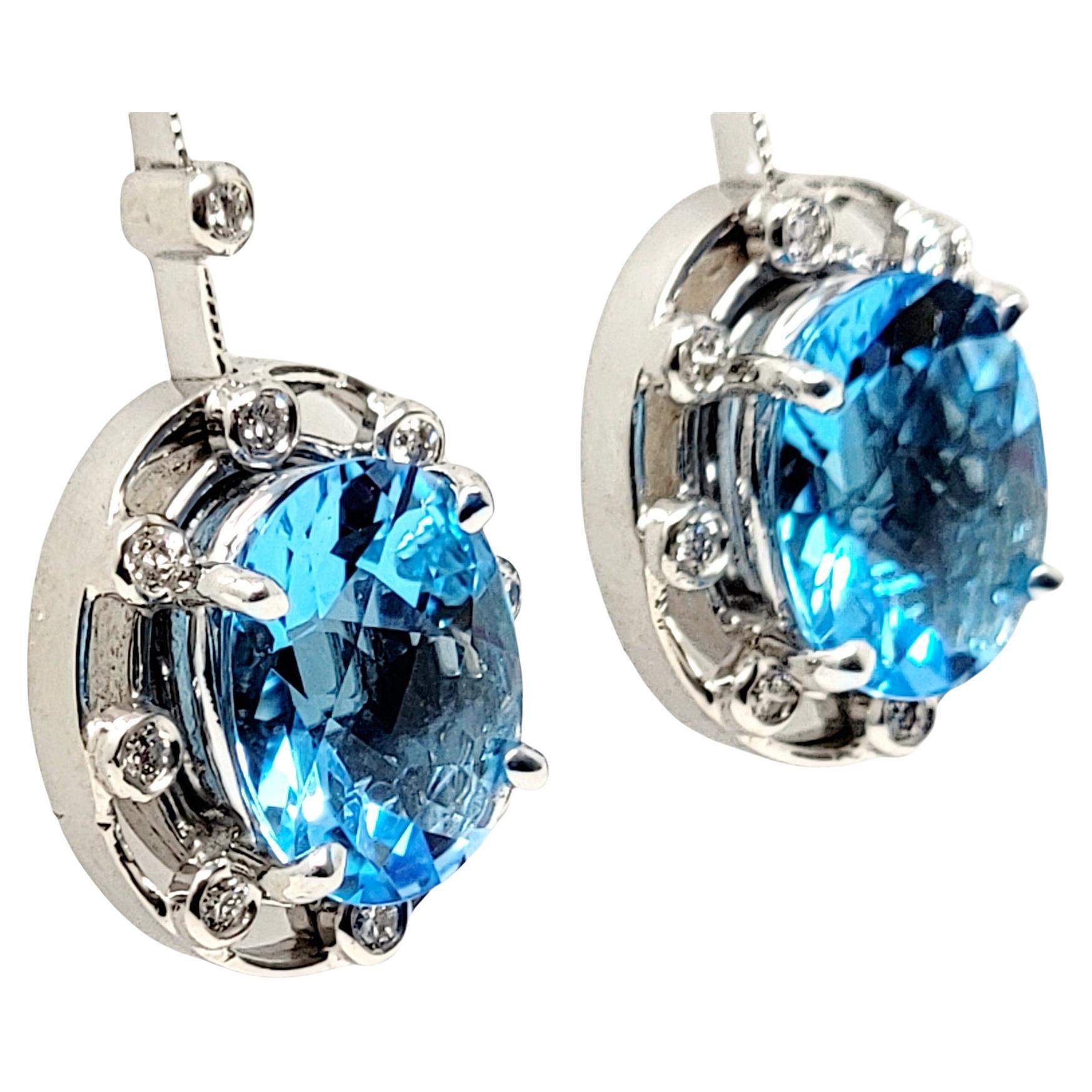 Incredible bright blue topaz drop earrings with shimmering diamond accents and polished 18 karat white gold. The contemporary beauties pop on the ear and look amazing!

Earring type: Drop
Metal: 18K White Gold
Weight: 6.5 grams
Natural Topaz: 6.12
