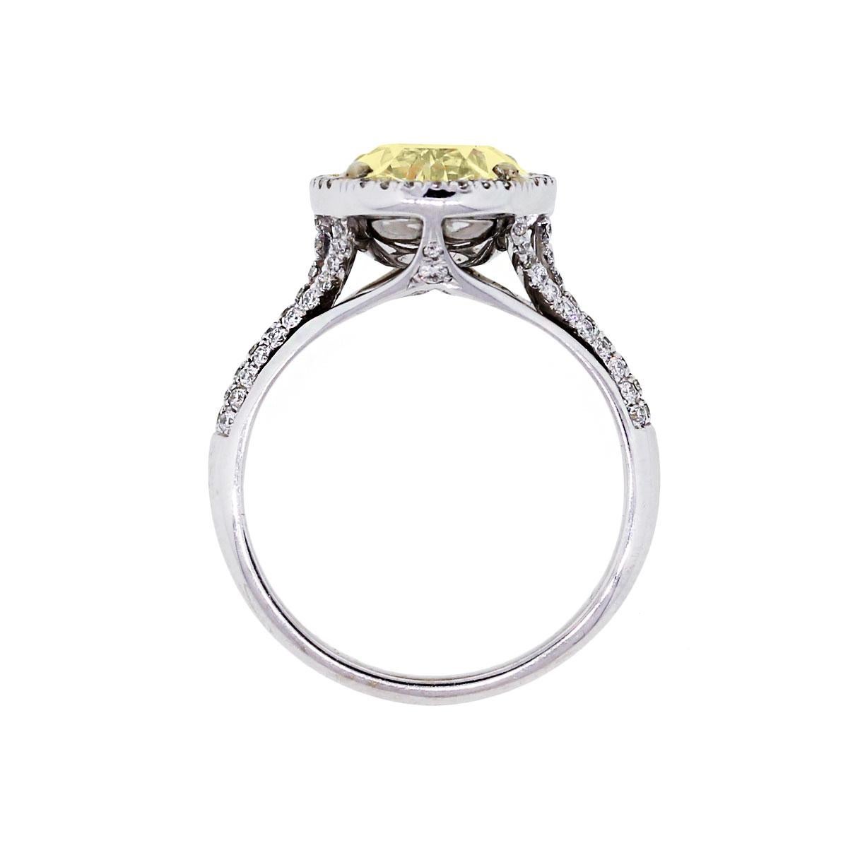 Material: 14k white gold
Diamond Details: 6.34ct Fancy Yellow Oval Cut center diamond
Side Diamond Details: Approximately 1ctw of round brilliant diamonds. Diamonds are G in color and VS2 in clarity
Size: 7.5 (can be sized)
Total Weight: 5.9g