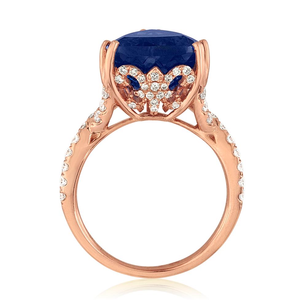 Very Unusual Tanzanite Trillion Cut Ring.
The ring is 18K Rose Gold.
There are 0.84 Carats in Diamonds G/H SI.
The Tanzanite is 6.34 Carats Trillion Cut.
The ring is a size 6.5, sizable.
The ring weighs 6.7 grams.