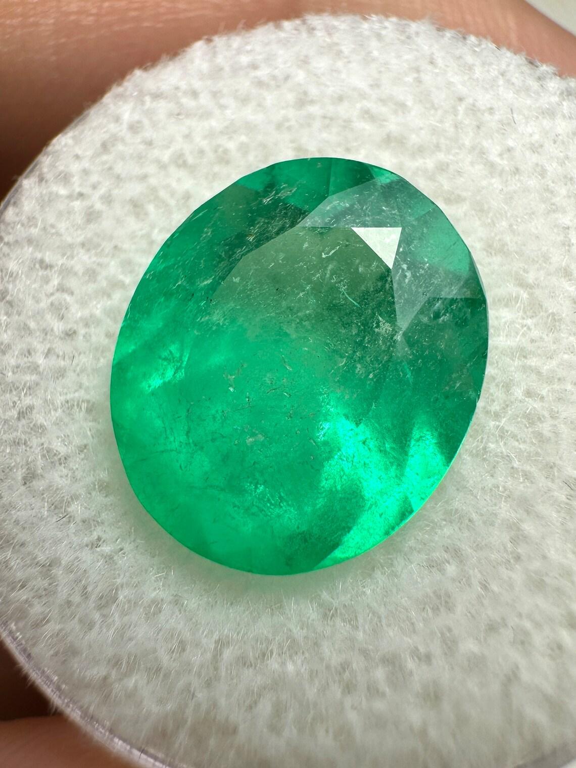 Stone: Emerald
Weight: 6.35-carats
Shape: Oval Cut
Clarity: Transparent to Semi-Transparent
Luster: Very Good
Color: Neon Yellowish Green
Measurements: 13.35mm x 11.35mm x 8.14mm
Geographic Origin: Colombia
Treatment: Natural, Oiling

Comments: Due
