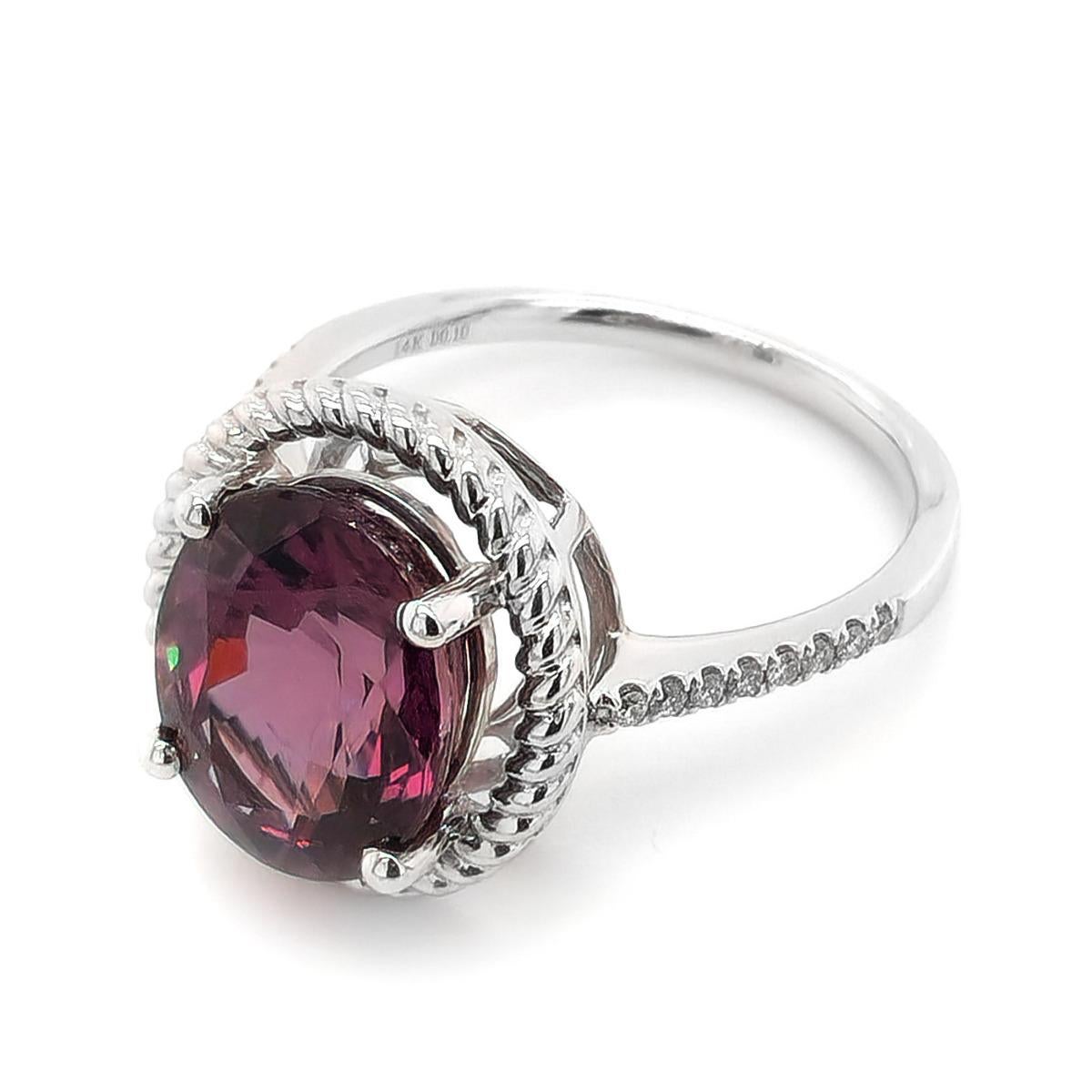 Oval shaped and filled with brilliance and shine, this color change Garnet will steal her heart. The popular trending shape that elongates and the finger is becoming a go to for modern day couples. The 6.35 carat centrally set eye clean gem alters