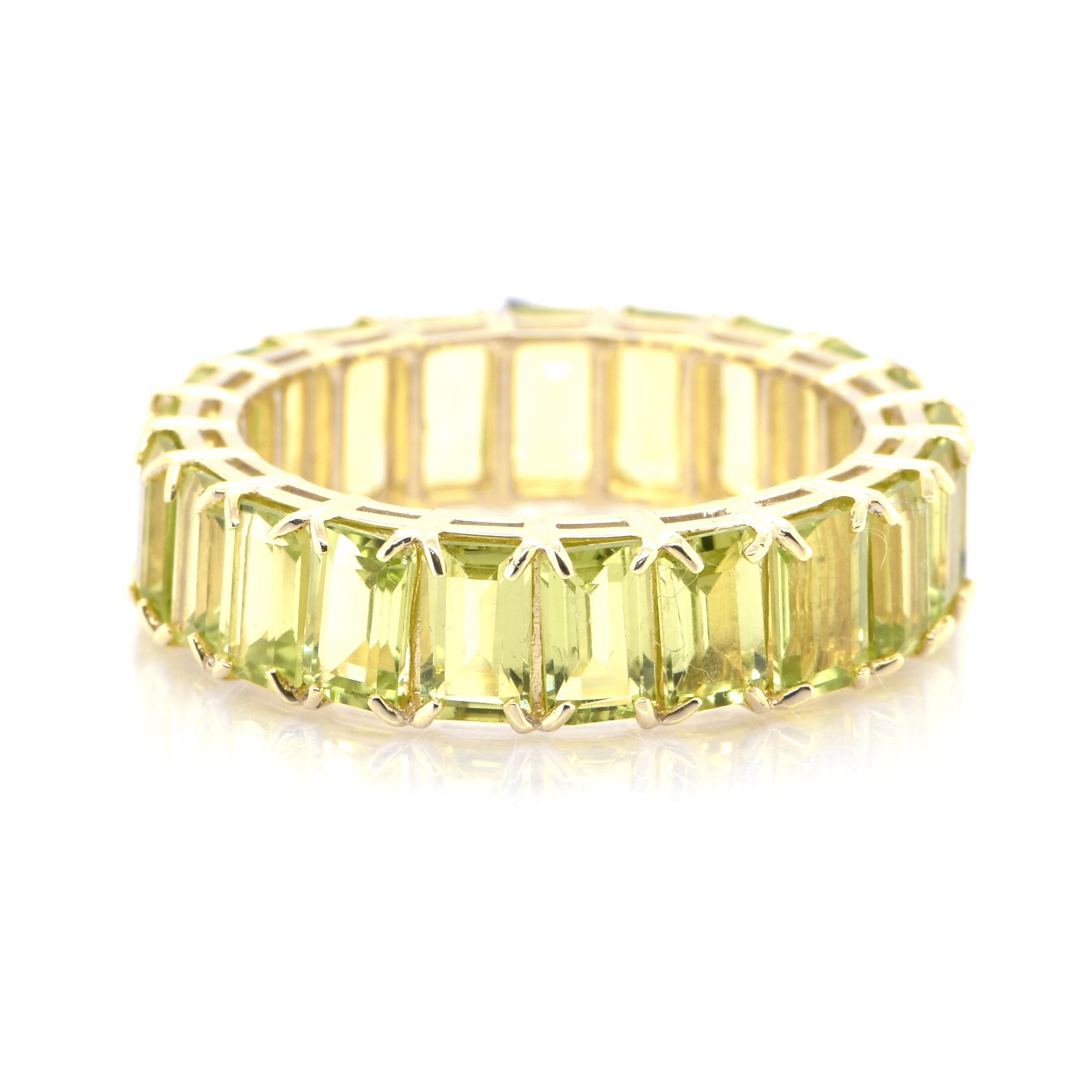 A beautiful full eternity Ring featuring 6.35 Carats Natural Peridot set in 18 Karat Yellow Gold. From the earliest times, people confused Peridot with other gems such as Emerald and Topaz. Some historians believe that Cleopatra’s famous emerald
