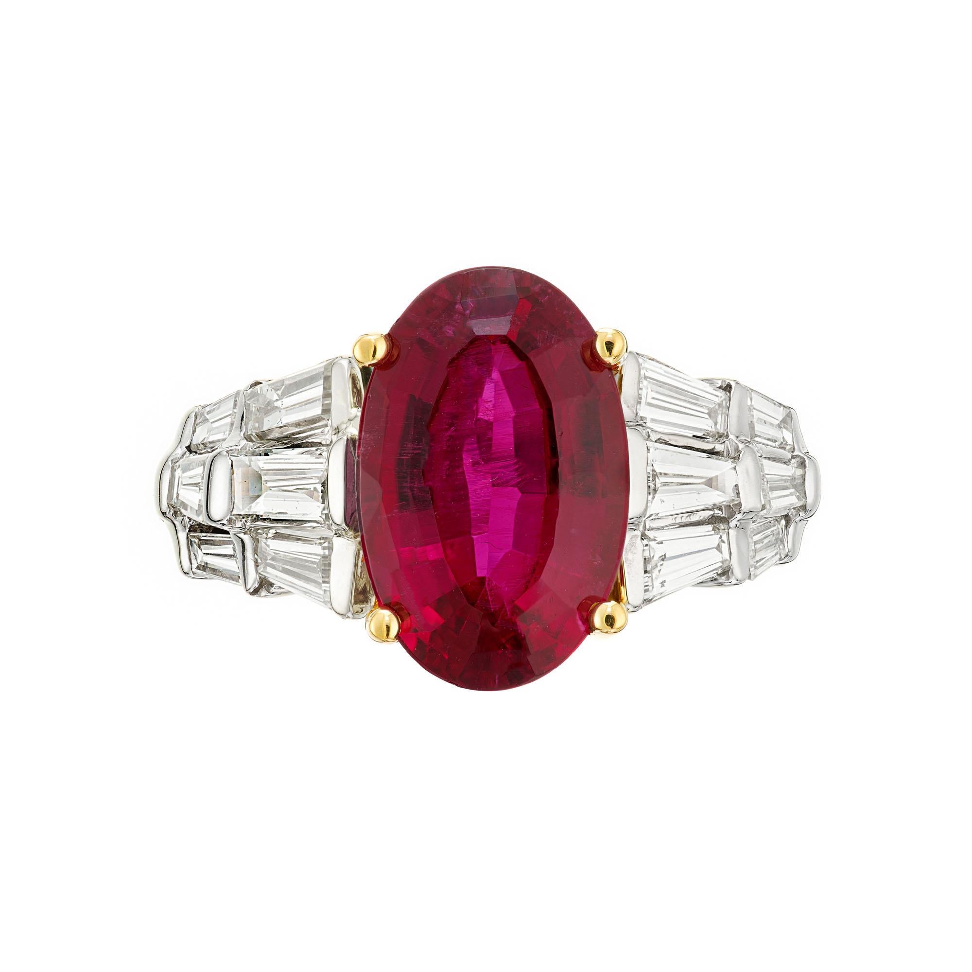 Bright red Rubelite Tourmaline and diamond cocktail engagement ring. Original 1950s GIA certified natural oval Rubelite Tourmaline center stone with straight and tapered baguette side diamonds in a 14k white and 18k yellow gold setting.  

1 oval