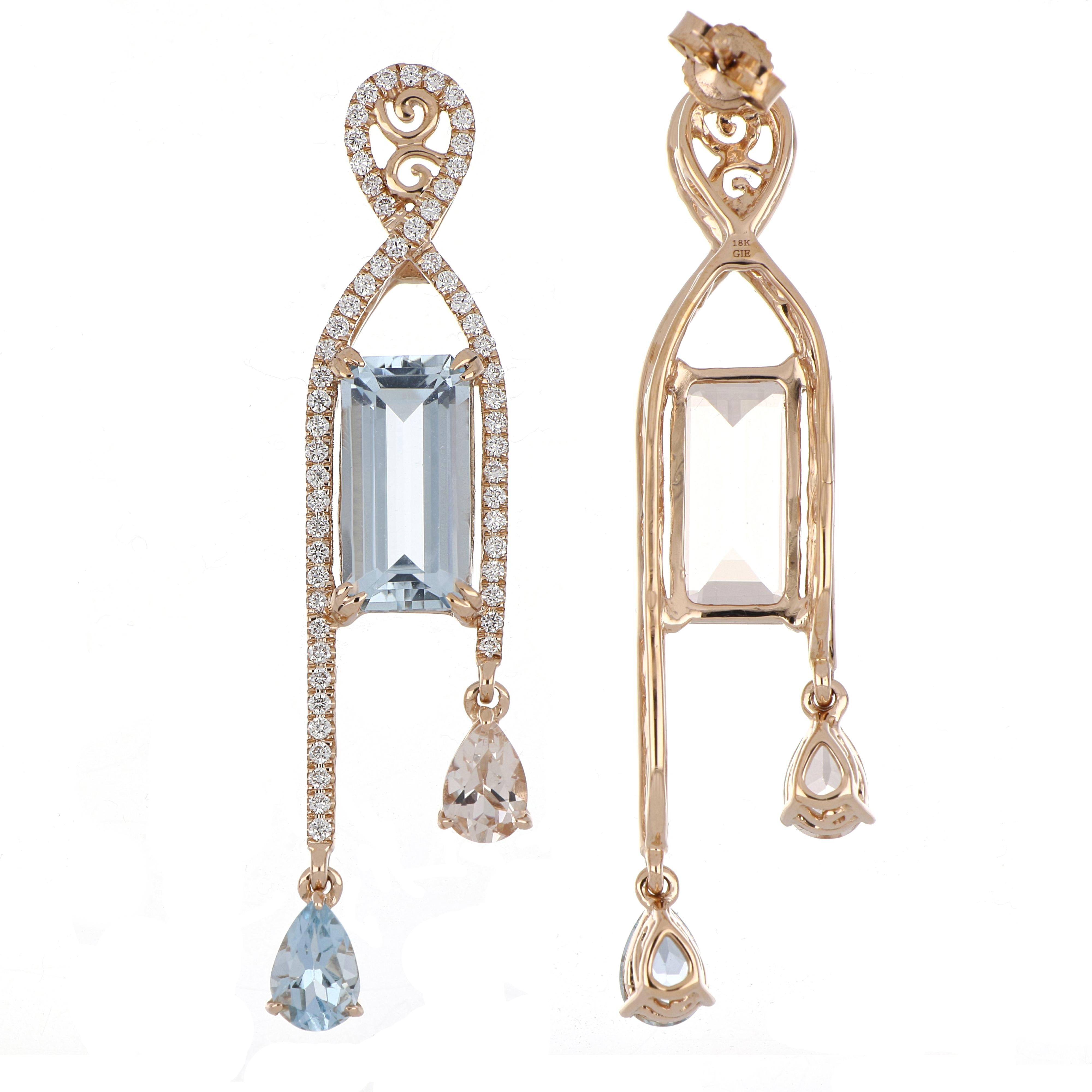 Elegant and Exquisitely detailed Mismatched Dangling Gold Earrings, set with 3.10 Ct (total ) Aquamarine, 3.25 Cts (total)  Morganite, accented with micro pave Diamonds, weighing approx. 0.61 Cts. total carat weight. Beautifully Hand crafted in 18