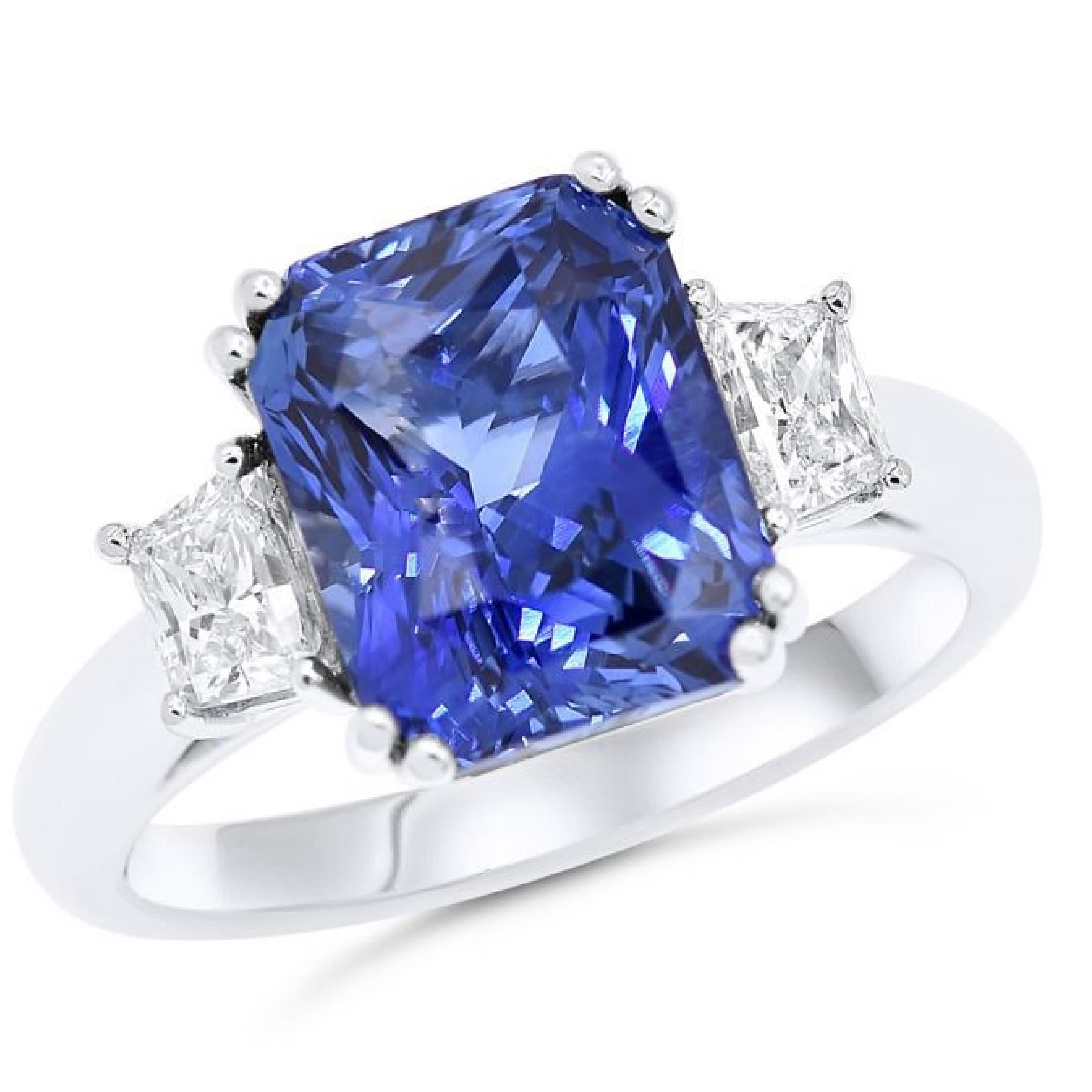 18K White Gold Sapphire and diamond engagement ring, features 6.36 Carat Radiant cut sapphire and 0.75 carats of trapezoids. 
G-H in color SI in clarity.
 