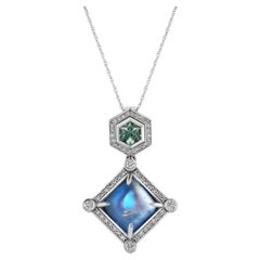 6.36ct Moonstone shines with a 0.53ct Montana Sapphire in 18K white gold pendant