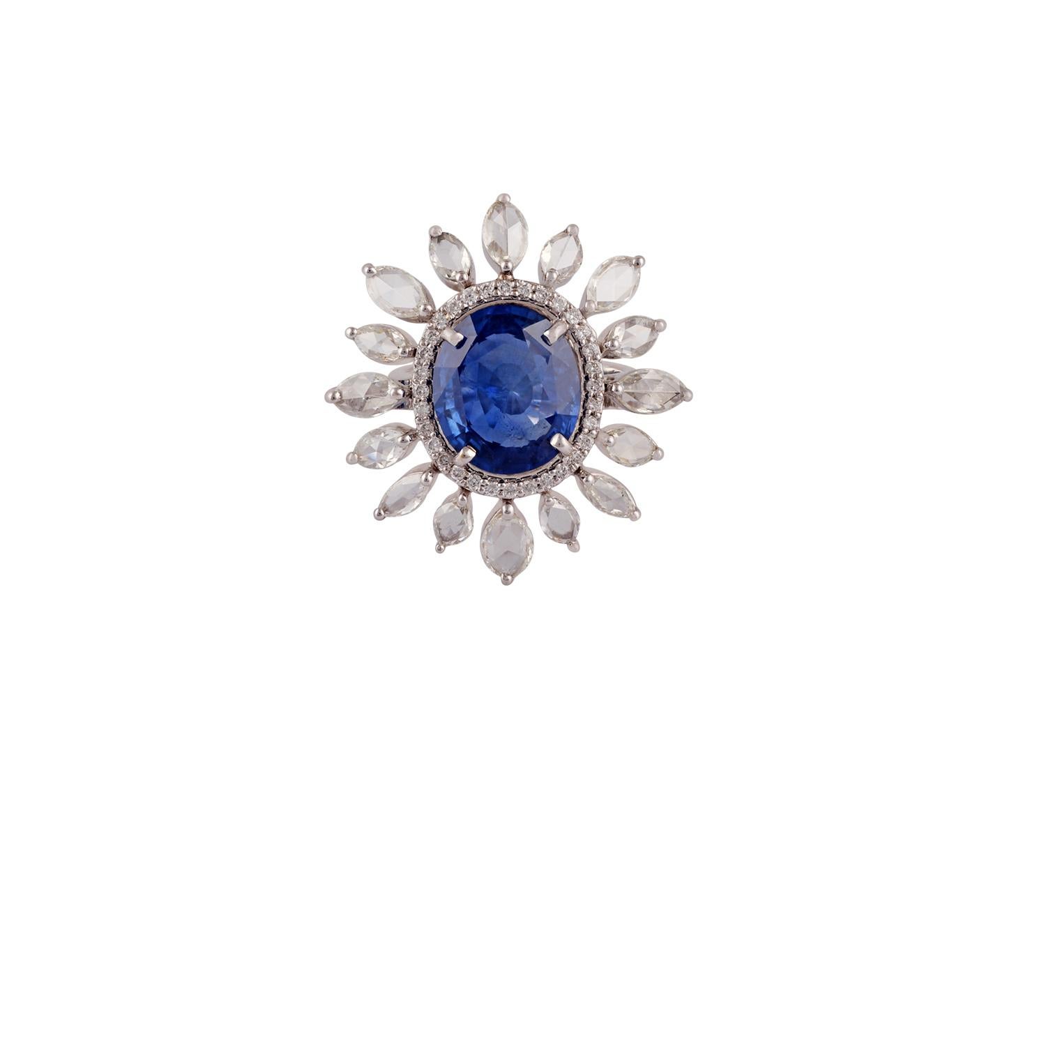This is an exclusive blue sapphire & diamond cluster ring studded in 18k gold features 1 piece of fine quality oval shaped blue sapphire weight 6.37 carat with 16 pieces of rose cut diamonds weight 2.21 carat & round shaped diamonds in the cluster