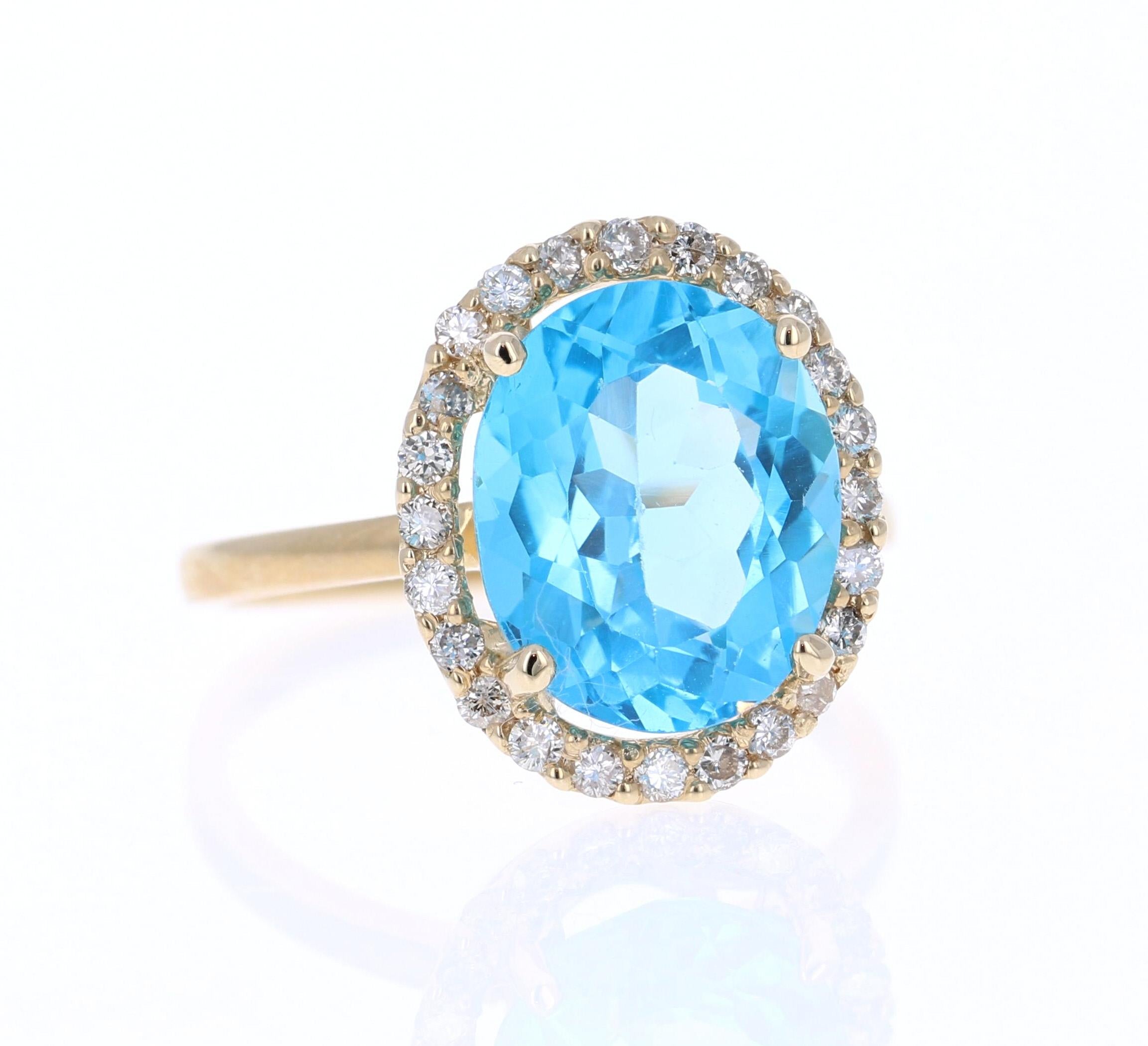This beautiful Oval cut Blue Topaz and Diamond ring has a stunning 6.01 Carat Blue Topaz and its surrounded by 24 Round Cut Diamonds that weigh 0.36 Carats. The total carat weight of the ring is 6.37 Carats. 

The setting is crafted in 14K Yellow