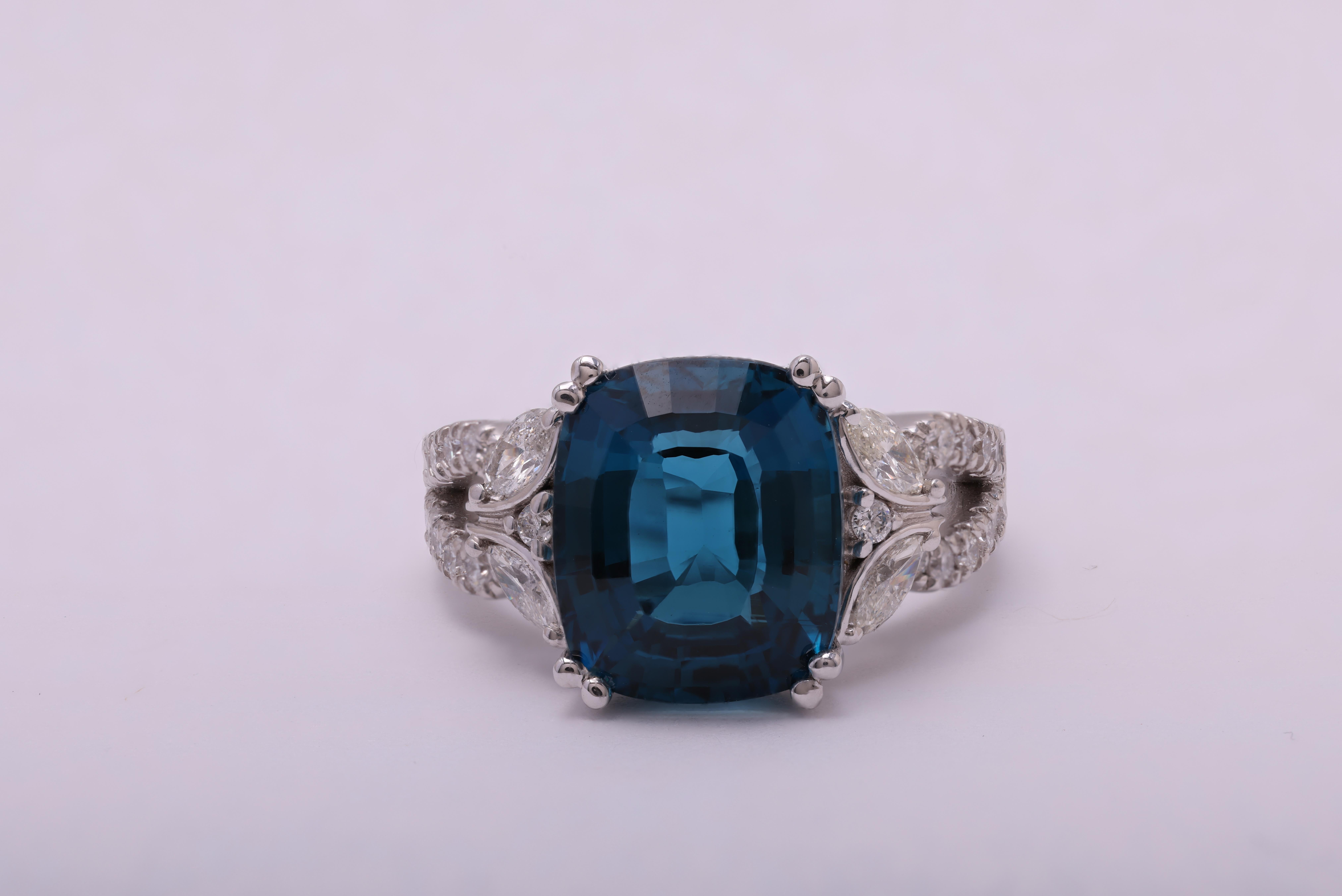 Contemporary 6.37 Carat Oval Cut London Blue Topaz and 0.78 Carat Diamond Ring ref1509 For Sale