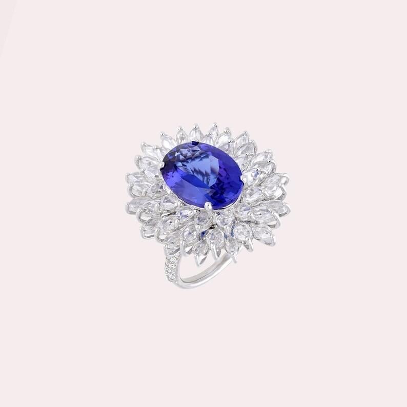 Forged from 18-karat gold, this unique ring is meticulously set with a 6.37-carat Tanzanite and 3.63 carats of glistening diamonds.

With its mesmerizing blue-violet hue, tanzanite is deeply connected to spiritual healing, transformation, and higher
