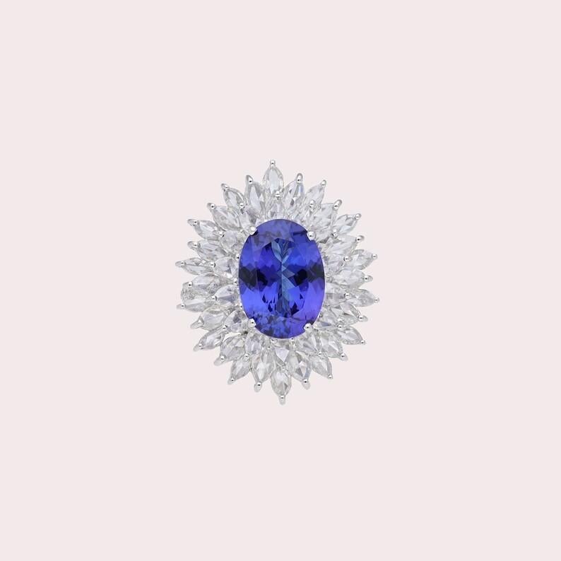 Contemporary 6.37 carats Oval Tanzanite 3.67 carats diamonds 18K White Gold Ring For Sale