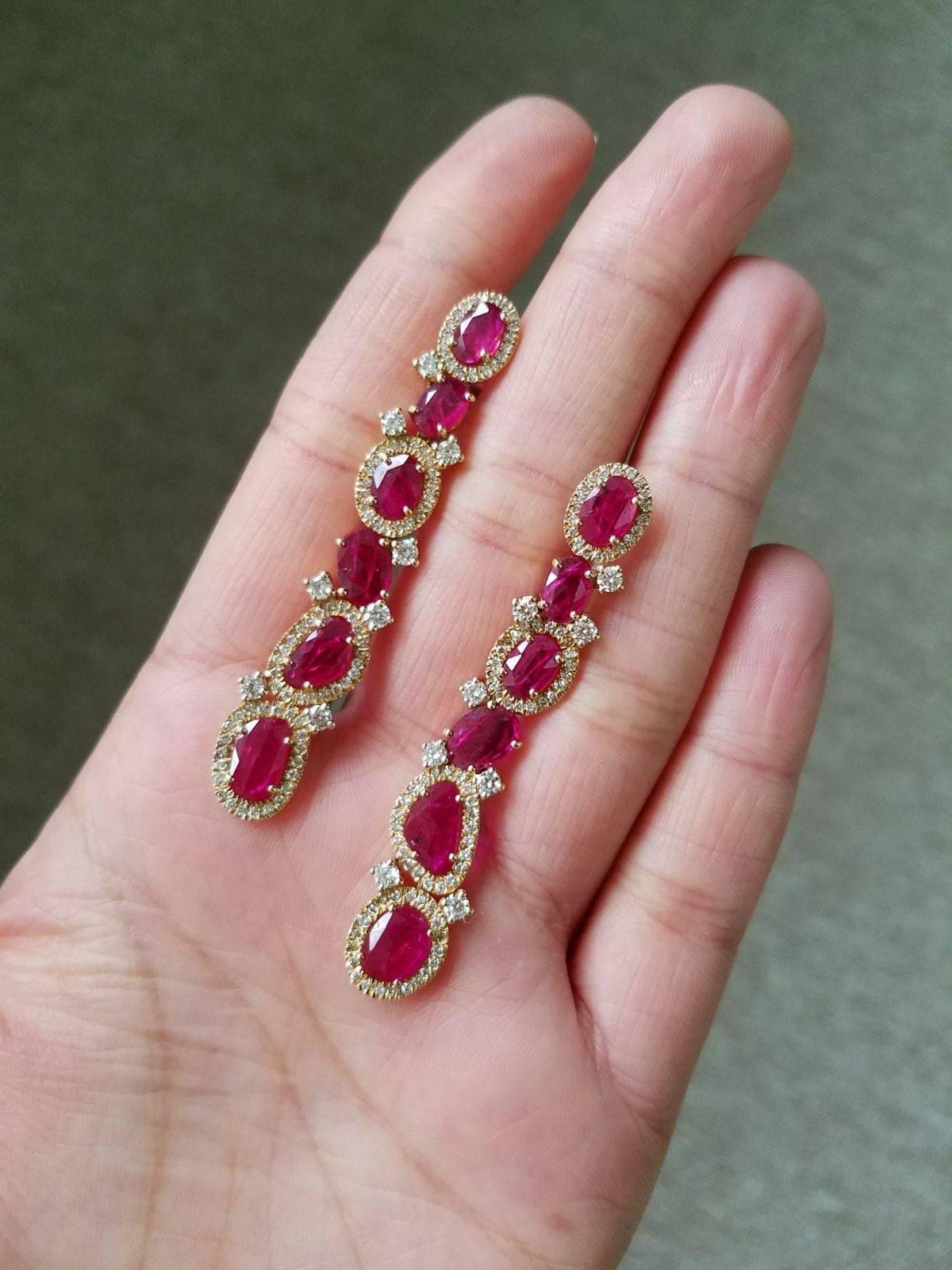 A beautiful pair of light-weight, statement, rose cut Mozambique ruby dangle earrings, set in 18K yellow gold with diamonds, with a push and pull backing.

Stone Details: 
Stone: Mozambique Ruby
Carat Weight: 6.380 Carats

Diamond Details: 
Total