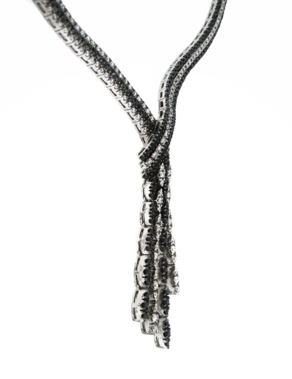 6.68 carat White and Black Diamond Tassel Necklace in 18K White Gold

Ladies 18K White Gold Diamond Necklace features rows of White and Black Round Brilliant Diamonds ending in a tassel, all set in 18k White Gold by Italian maker Karati.

Total