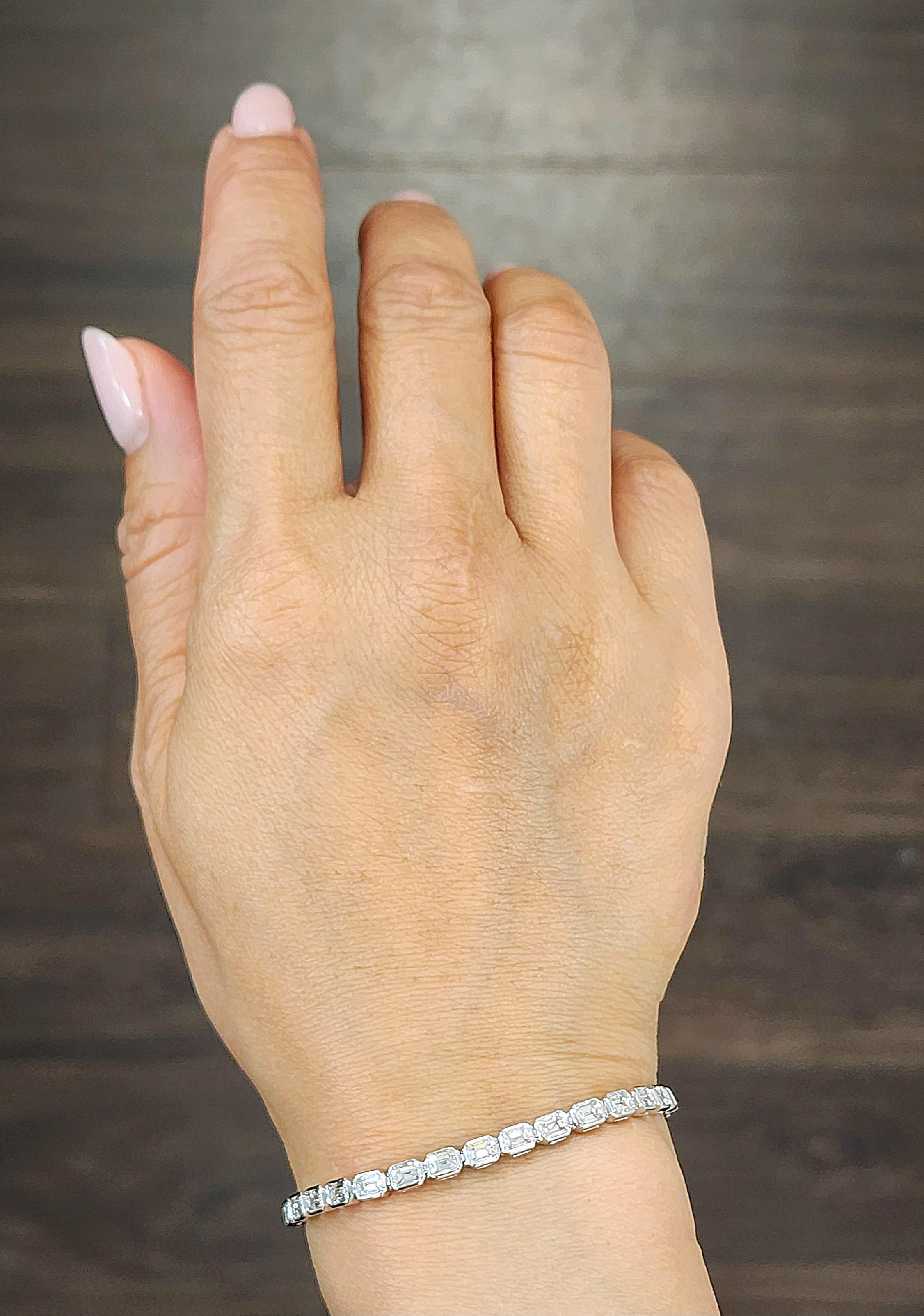 This gorgeous tennis bracelet is a stunning creation. Featuring 6.38 carats of emerald-cut white diamonds set east-west, each stone is graded F/G in color and VS1/VS2 in clarity. Crafted in luxurious platinum, this piece is a remarkable addition to