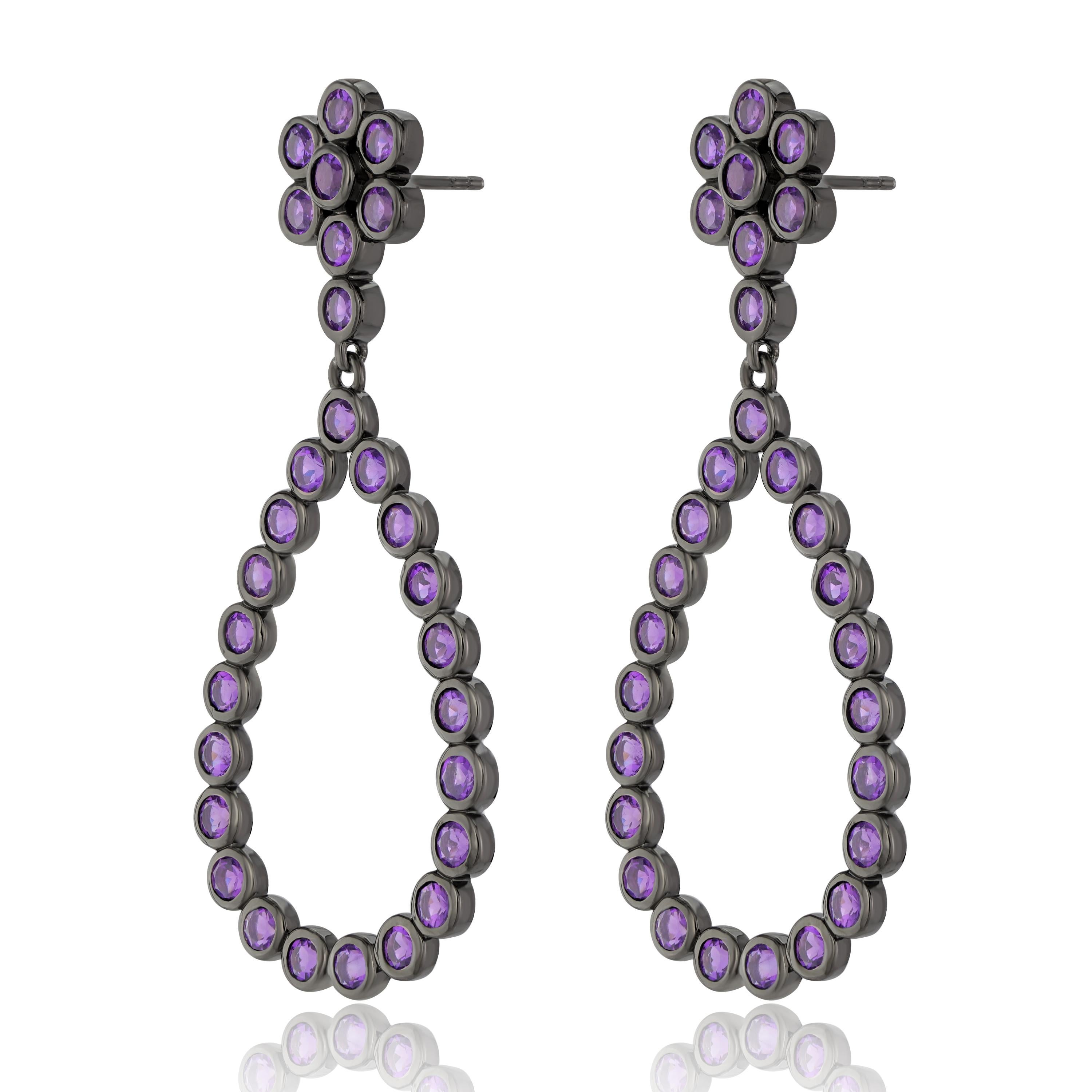 Known to be the birthstone for the month of February, amethyst helps the wearer for a balanced mindset. These women's earrings feature 3 mm amethyst 6.38Ct arranged in a floral and open teardrop design. These earrings are crafted in genuine and