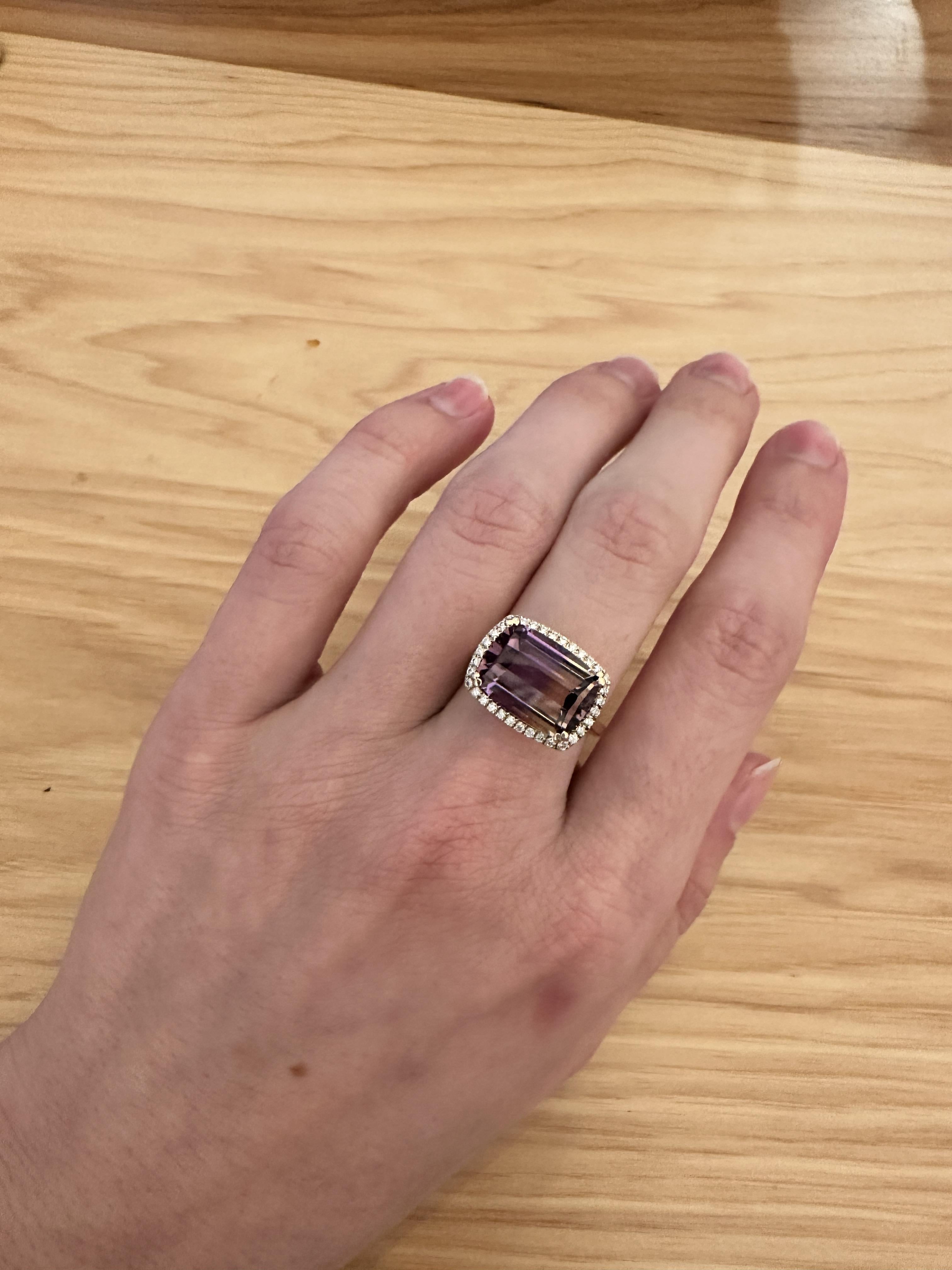Gorgeous 6.38 carat barrel cut Ametrine with rich yellow and purple colors highlighted by a halo of sparkling natural earth mined diamonds. This ring make a great statement piece!

**We offer complimentary resizing, message us the