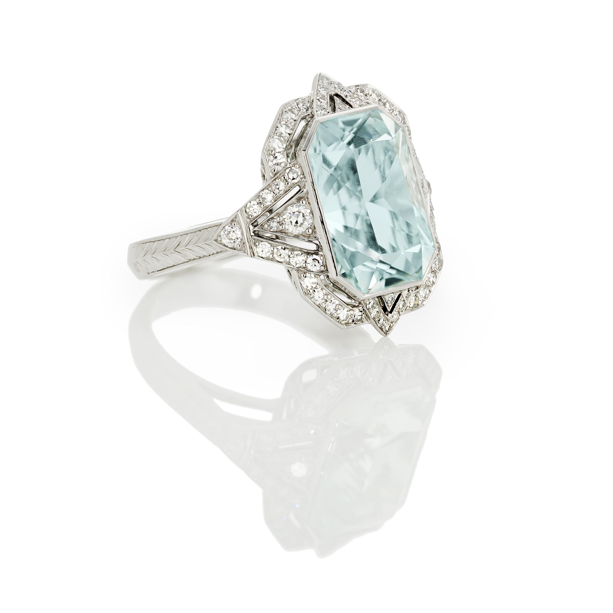 Such a lively and bright one of a kind ring.  The 5.94 Carat custom cut Radiant-shaped Aquamarine surrounded with an original design, including hand engraved details, featuring 0.45 Carats of Diamonds.  Set in Platinum 950.  Ring size 6 and can be